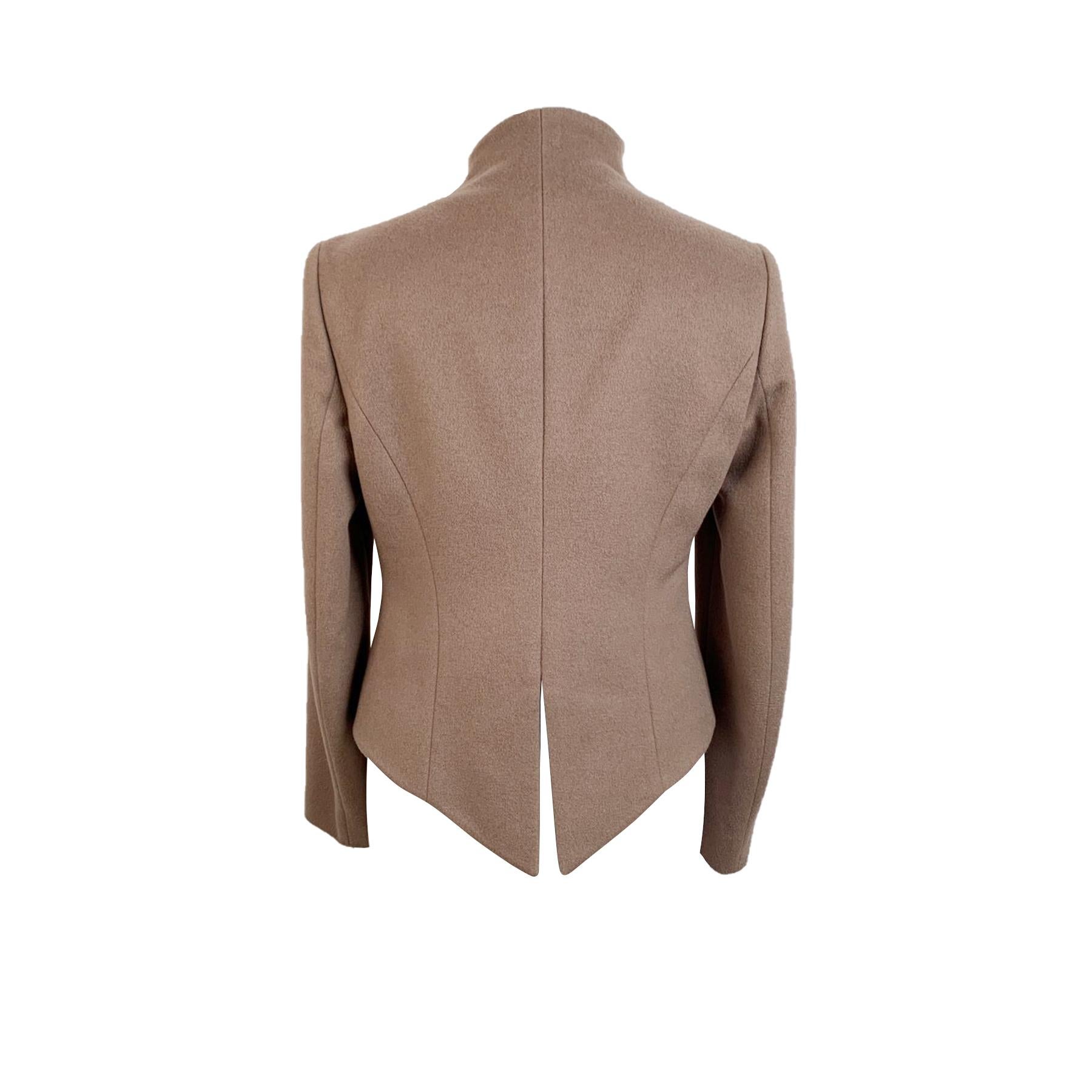 Emporio Armani beige cashmere jacket. Hook & Eye closure. Stand-up collar. 2 pockets on the waist. Rear slit. Lined. Size: 42 IT (The size shown for this item is the size indicated by the designer on the label). It should correspond to a SMALL