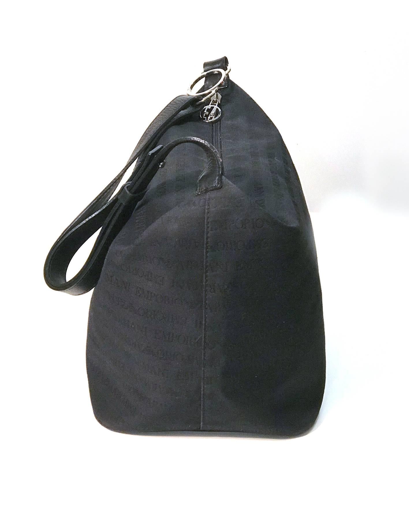 Women's or Men's Emporio Armani black canvas with monogram pattern shoulder bag. For Sale