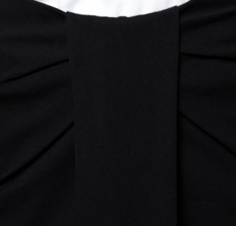 Pencil skirts are wardrobe staples and what better creation to add to your closet than this black one from Emporio Armani! The jersey skirt features a front pleated silhouette and comes equipped with a zip closure. It will look great with a silk