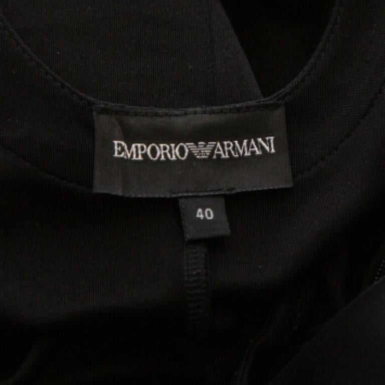 Don this elegant outfit from the house of Emporio Armani. A classic black dress like this can be effortlessly paired with statement accessories. This jersey dress will keep you at the top of your fashion game.