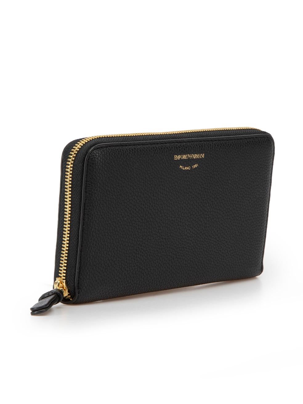 CONDITION is Very good. Hardly any visible wear to wallet is evident on this used Emporio Armani designer resale item. 
 
 Details
 Black
 Leather
 Wallet
 Branded logo on front
 Zip closure
 Two main compartments
 1x Centre zip pocket
 2x Notes