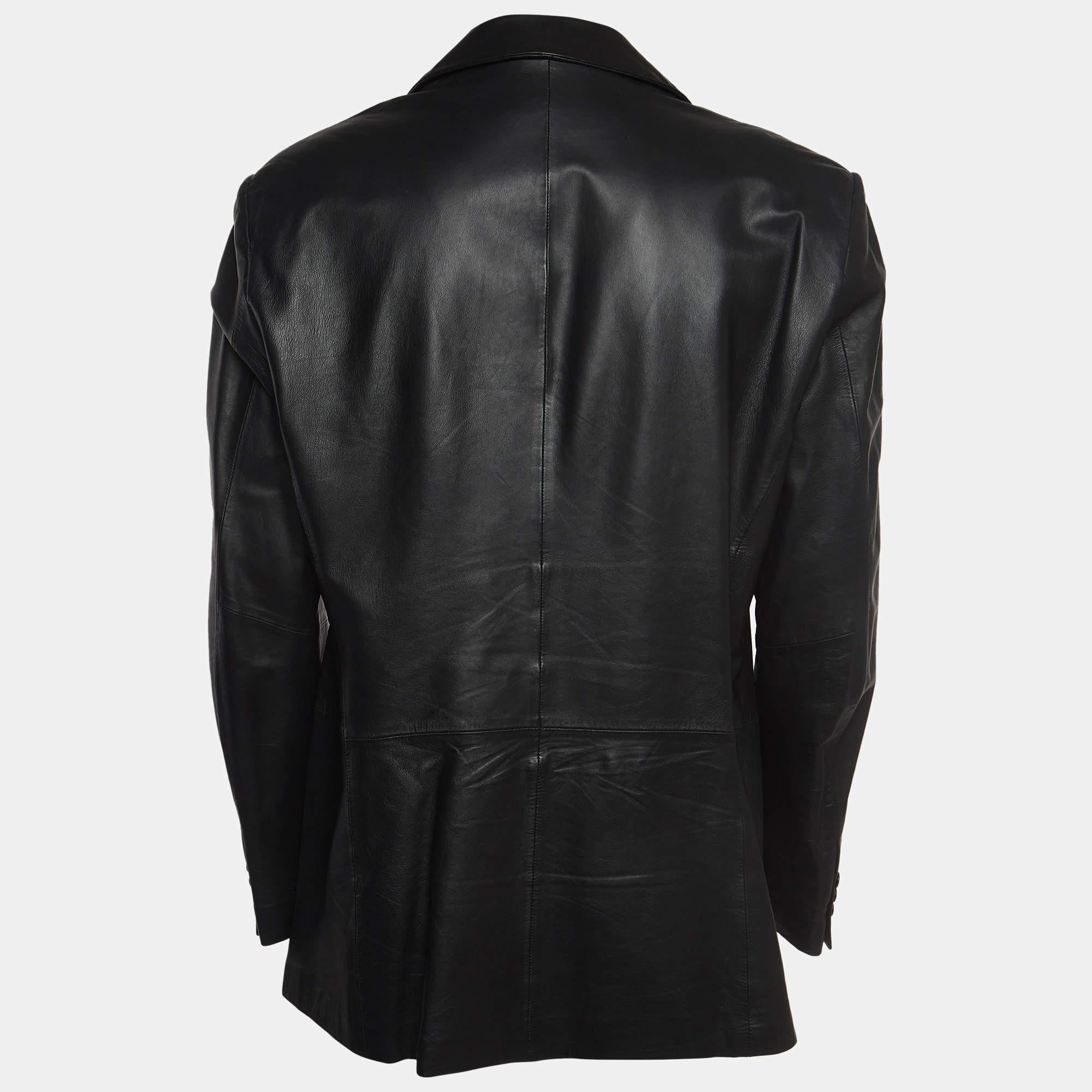The Emporio Armani coat exudes timeless elegance. Crafted from luxurious black leather, its single-breasted design and button detailing epitomize sophistication. With a perfect blend of style and comfort, this coat effortlessly elevates any