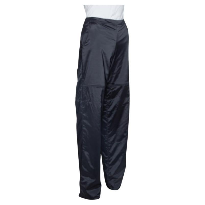 These stylish wide-legged pants hail from the house of Emporio Armani. Crafted from quality material, they come in a classic shade of black. Theya re perfect for casual days and have a padded style. They are secured with a zip closure and have two