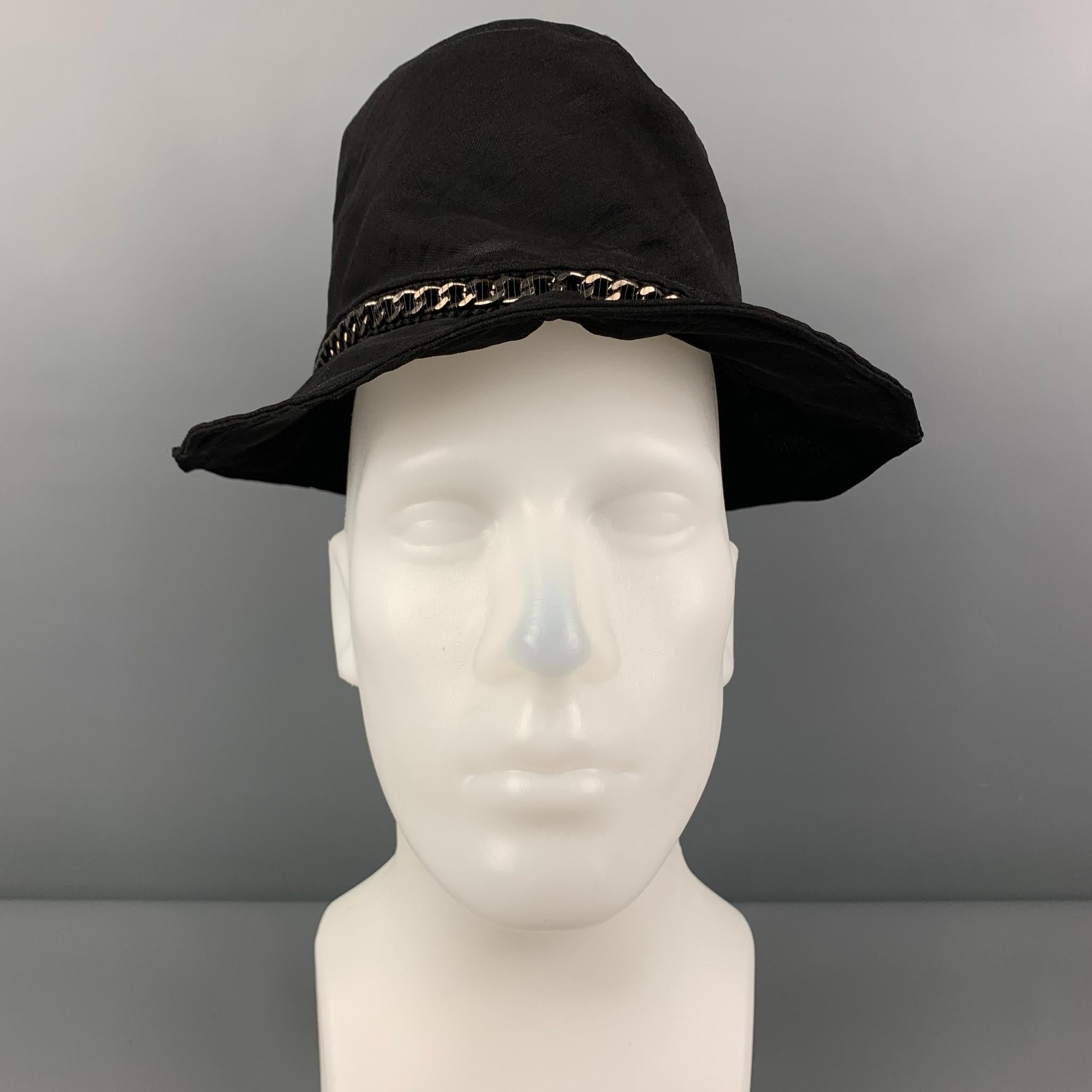 EMPORIO ARMANI bucket hat comes in a black see through silk featuring a chain link detail. Made in Italy. 

New With Tags.
Marked: 56

Measurements:

Opening: 22 in.
Brim: 2.5 in.
Height: 3.75 in. 