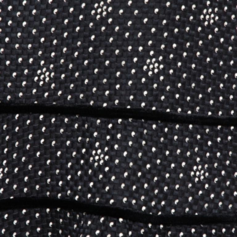 Perfect for fun outings with friends, this stylish Emporio Armani skirt is a must-have. Crafted from a lovely blend of silk & wool that results in a textured exterior. The skirt has a printed expanse that is further styled with tiers. It is finished