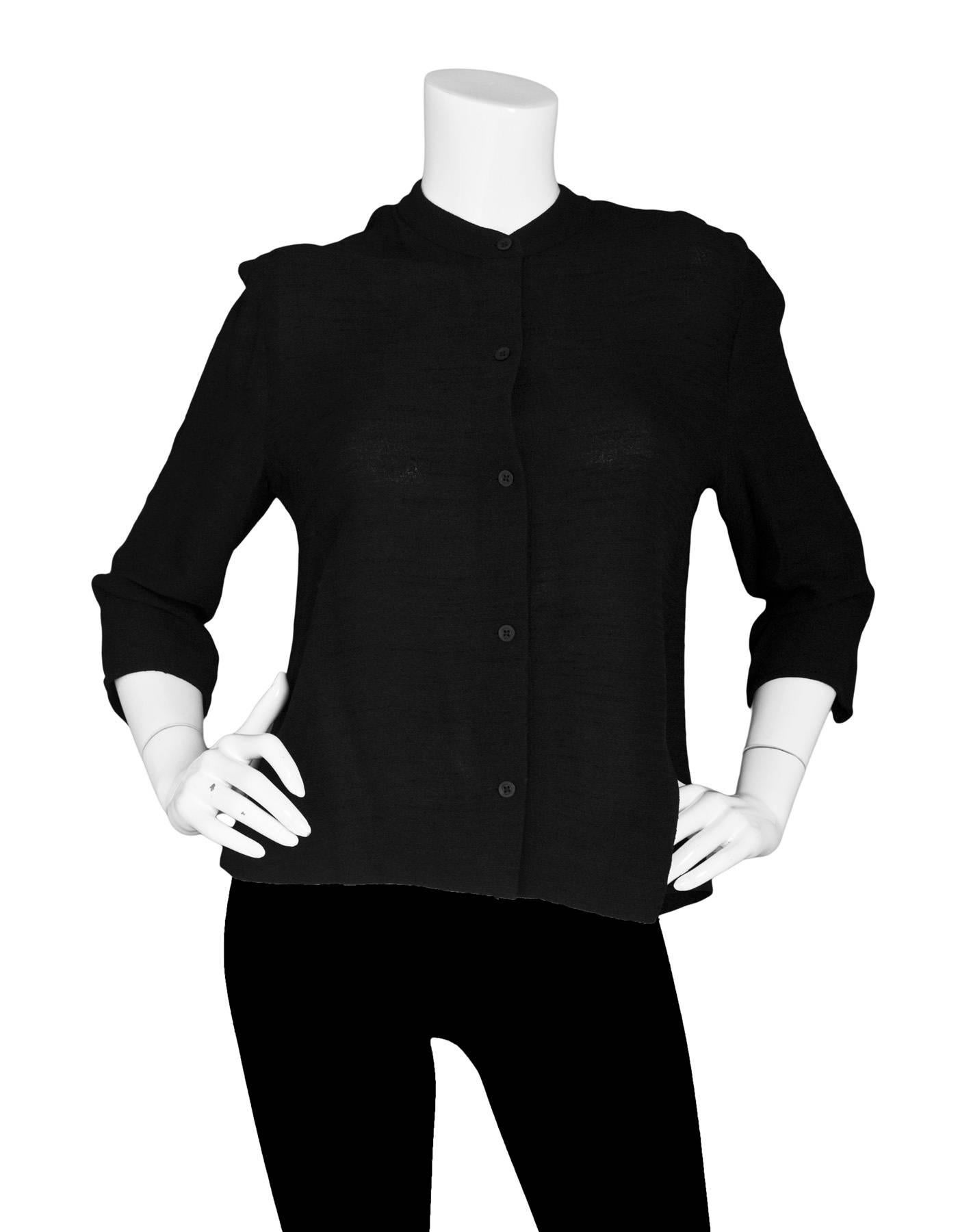 Emporio Armani Black Top SZ IT44

Made In: Italy
Color: Black
Composition: Not listed, feels like nylon blend
Lining: None
Closure/Opening: Front button closure
Exterior Pockets: None
Interior Pockets: None
Overall Condition: Excellent pre-owned