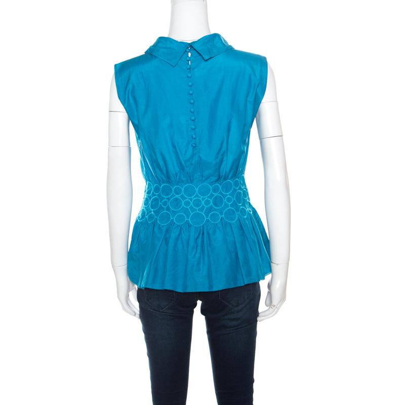 Emporio Armani's top, made from a cotton and silk blend, is a lovely piece to don an understated yet chic ensemble for your casual look. Beautifully embroidered at the waist, this sleeveless top is pleated below the bust creating a loose peplum