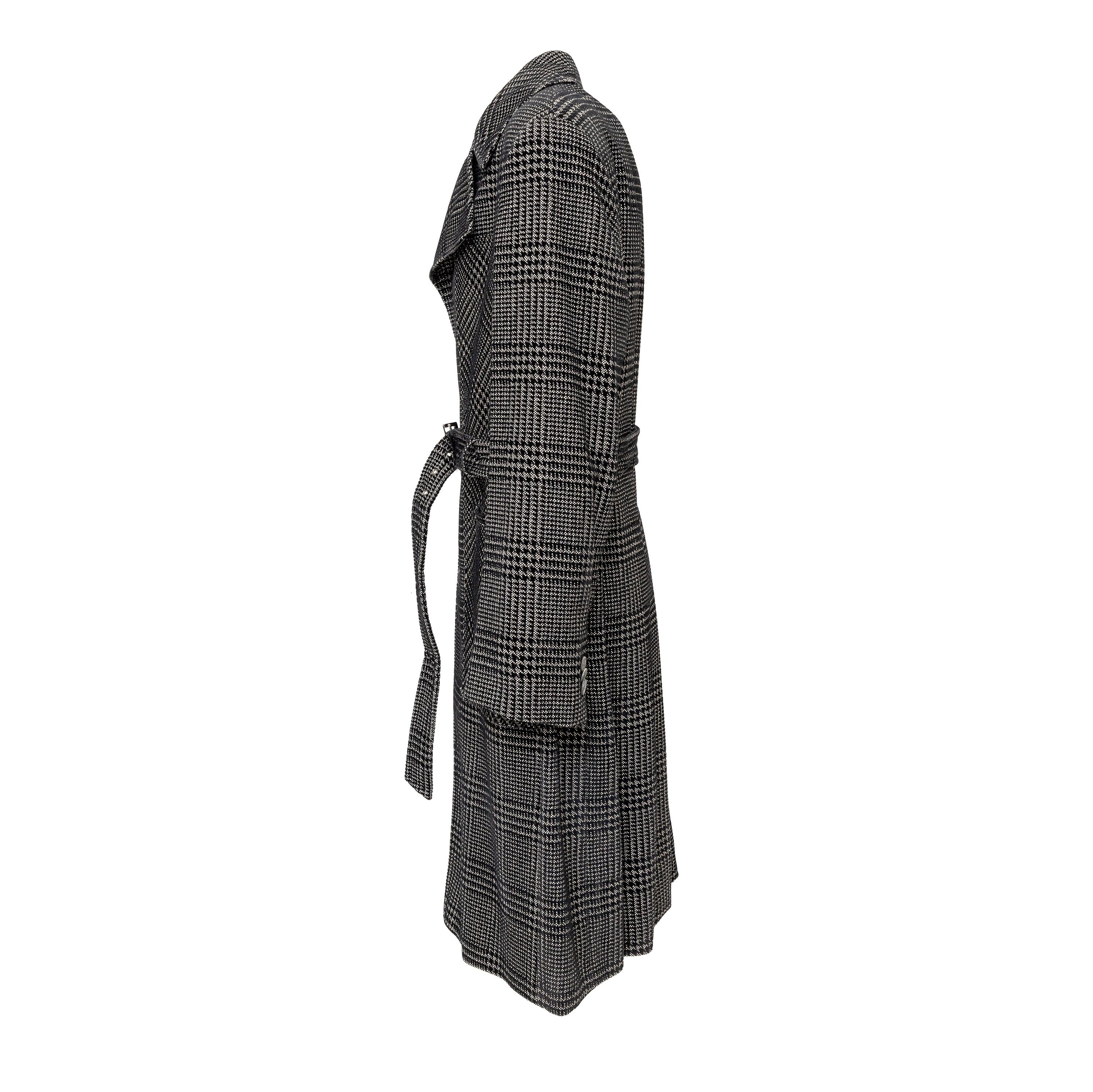 Elevate your winter wardrobe with the Emporio Armani Checkered Long Coat. Crafted with a luxurious wool blend, this coat features a stylish checkered pattern, accented with velvet detailing. The notched label collar, front button closure, and waist