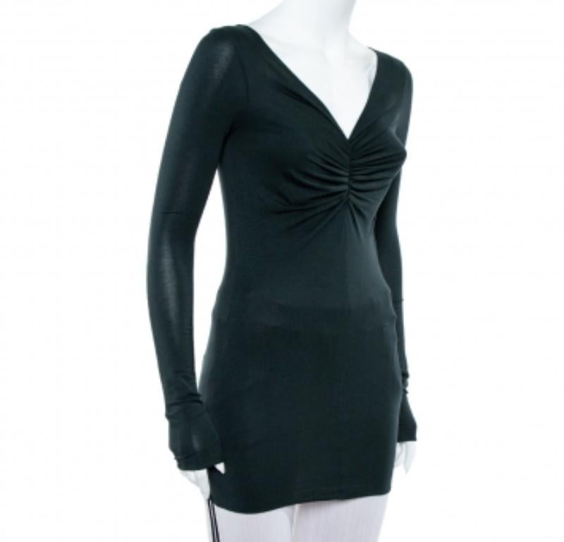 From the house of Giorgio Armani, this tunic is the immaculate balance between simplicity and fresh chic. Crafted from a blend of fabrics, it features ruched details at the center that beautifully forms a V- neckline. The tunic is finished off with
