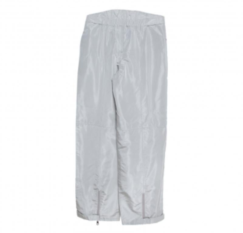 These Emporio Armani pants are simple and sophisticated. They are made of coated canvas and feature a high waisted silhouette.  They come equipped with a zip closure and a zip pocket. Pair them with t-shirts and smart sneakers.