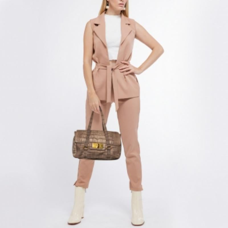 This satchel is built to hold your essentials in the most fashionable way! Easy to style, well-made using best materials, and coming from the top brand, the satchel will add immense style to your ensemble.
