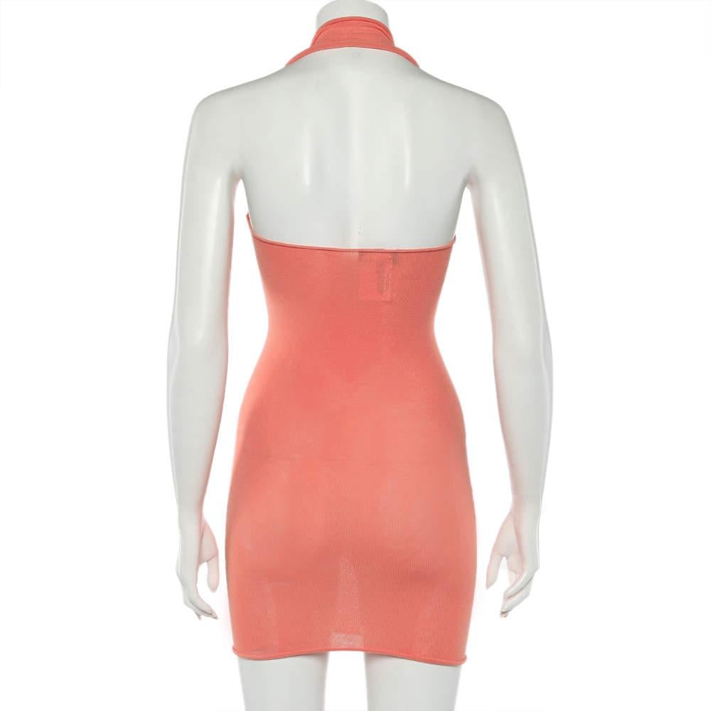 Appear party-ready and appealing in this beautiful mini dress from Emporio Armani. It is fashioned in orange knit fabric, with matching embellishments placed on the plunging neckline. It flaunts a halter-neck style and a well-fitted shape. This