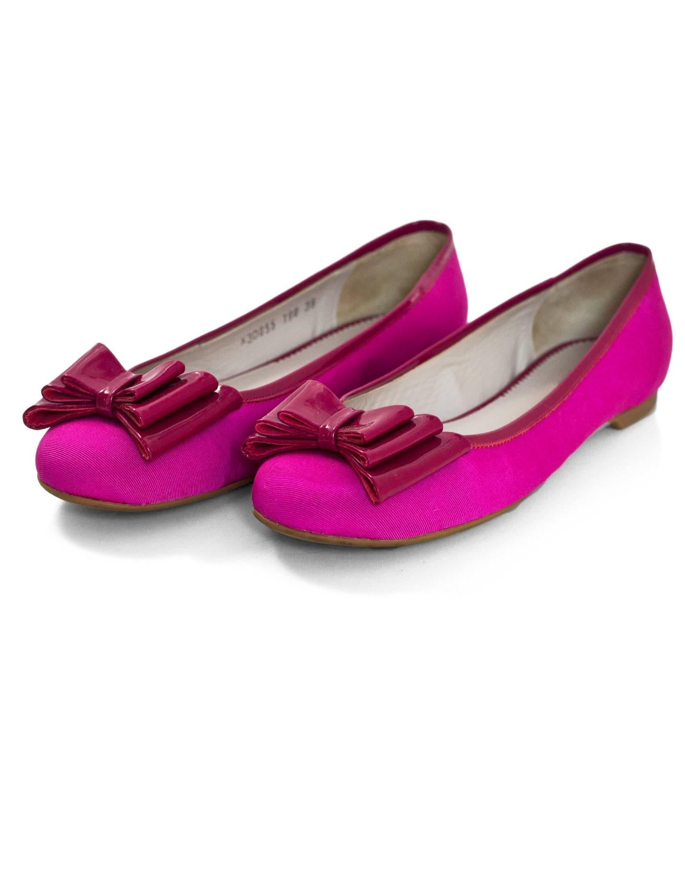 Emporio Armani Pink Ballet Flats with Bow Sz 39

Color: Pink
Materials: grossgrain, patent leather
Closure/Opening: Slide on
Sole Stamp: Emporio Armani
Retail Price: $295 + tax
Overall Condition: Excellent pre-owned condition with the exception of