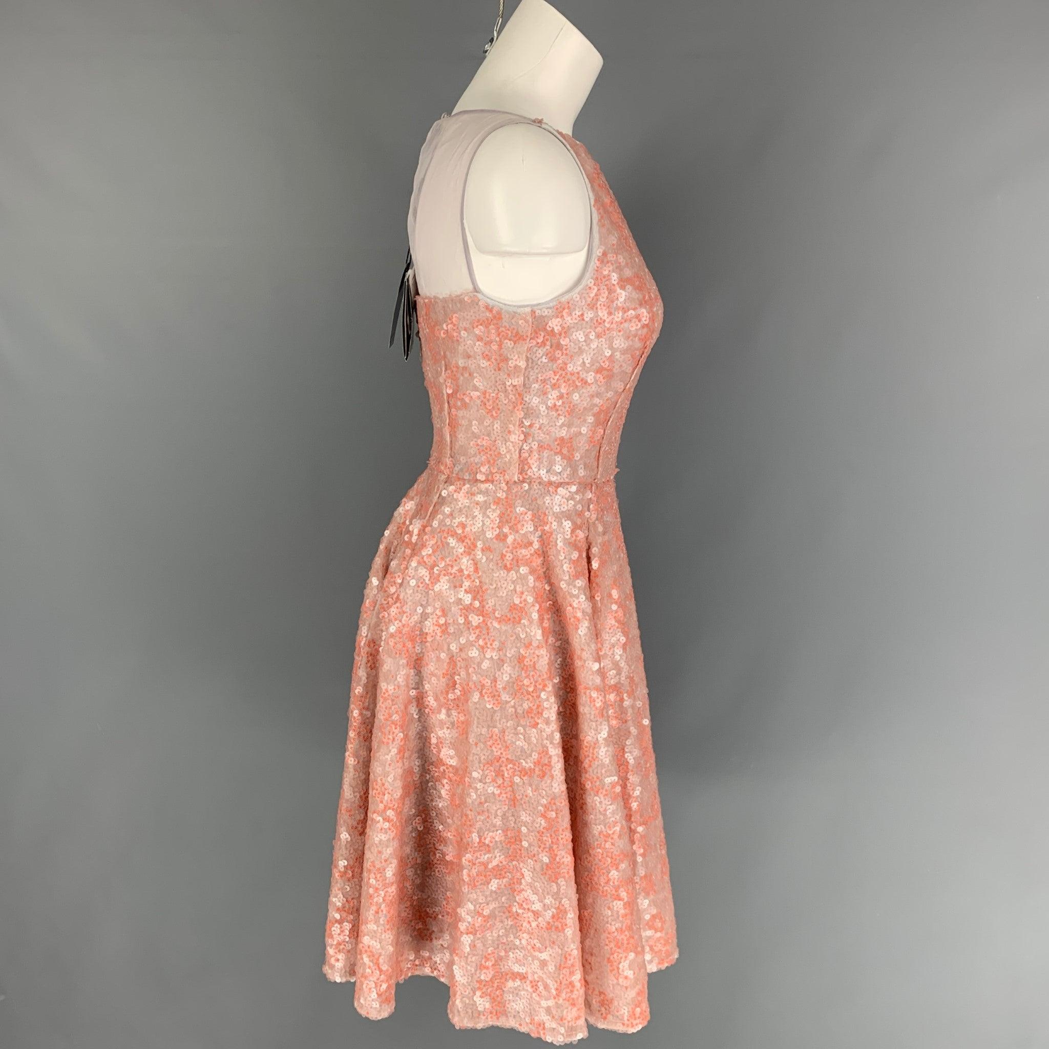 EMPORIO ARMANI dress comes in a orange sequin polyester with a slip liner featuring an a-line style, lae back panel, sleeveless, and a back zip up closure.
New With Tags.
 

Marked:   36 

Measurements: 
 
Shoulder: 13 inches  Bust: 26 inches 