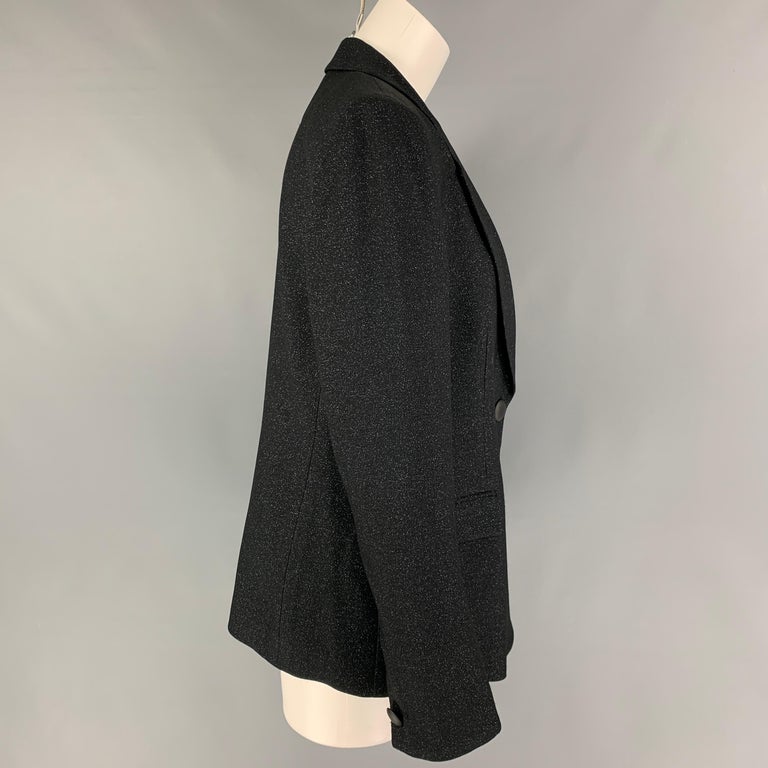 EMPORIO ARMANI blazer comes in a black & blue viscose blend featuring a notch lapel, flap pockets, single back vent, and a single button closure. 

Excellent Pre-Owned Condition.
Marked: 46

Measurements:

Shoulder: 17 in.
Bust: 39 in.
Sleeve: 26