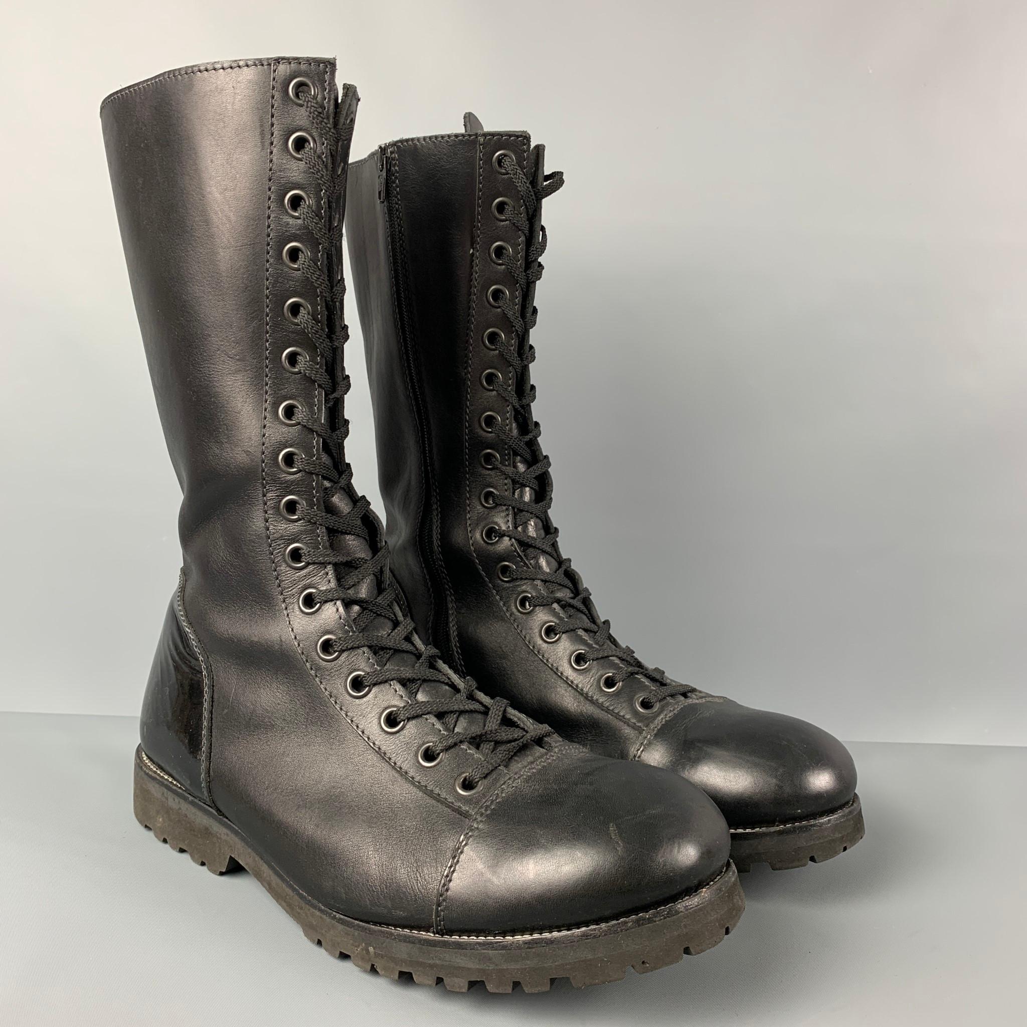 EMPORIO ARMANI boots comes in a black leather with a patent leather trim featuring a combat style and a lace up closure. 

Very Good Pre-Owned Condition.
Marked: 45

Measurements:

Length: 13 in.
Width: 4 in.
Height: 12 in. 
