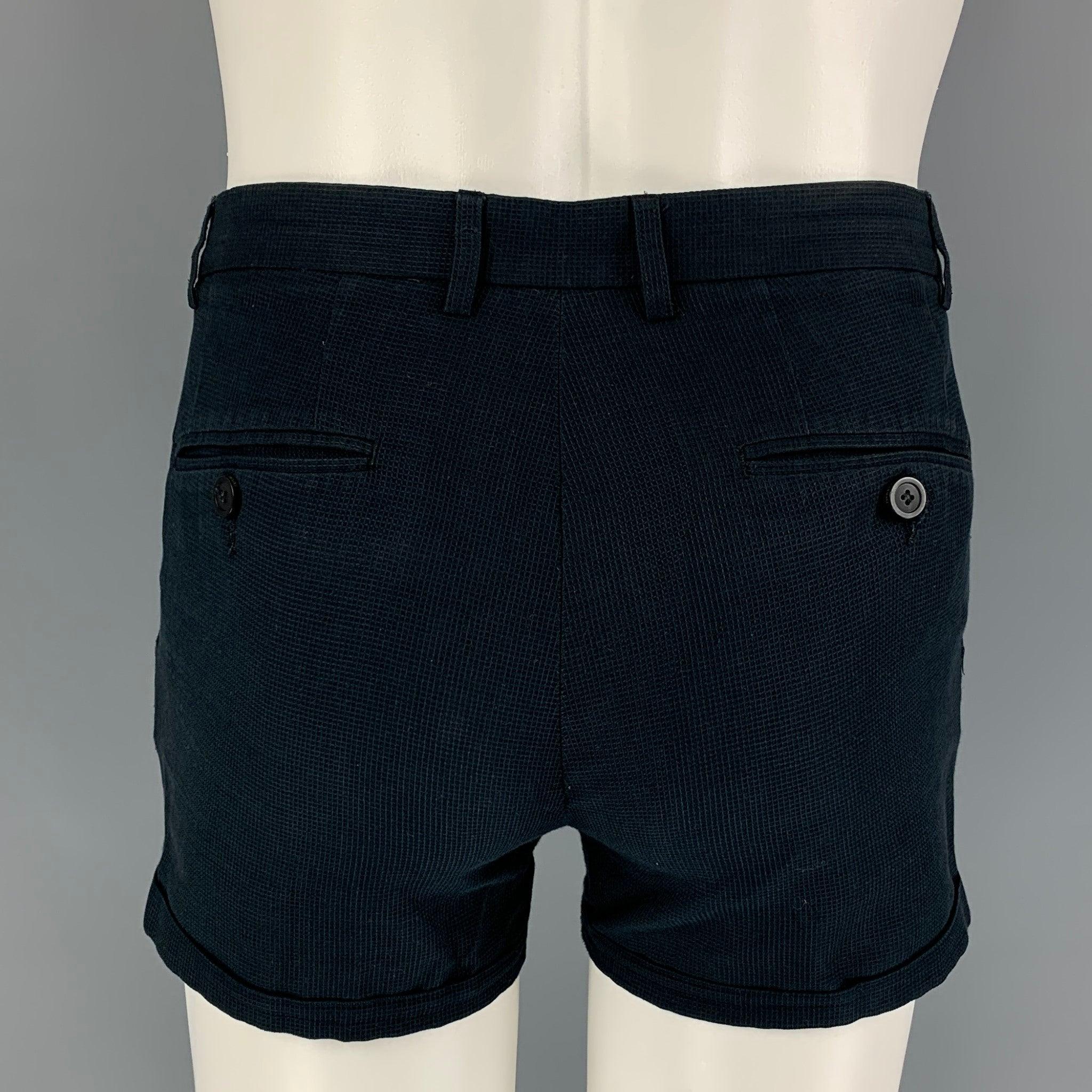 EMPORIO ARMANI 'Robert Line' shorts comes in a navy textured cotton featuring a mini style, cuffed, and a zip fly closure.
Good
Pre-Owned Condition. Light wear. As-Is. 

Marked:   46 

Measurements: 
  Waist: 30 inches  Rise: 9.5 inches  Inseam: 3