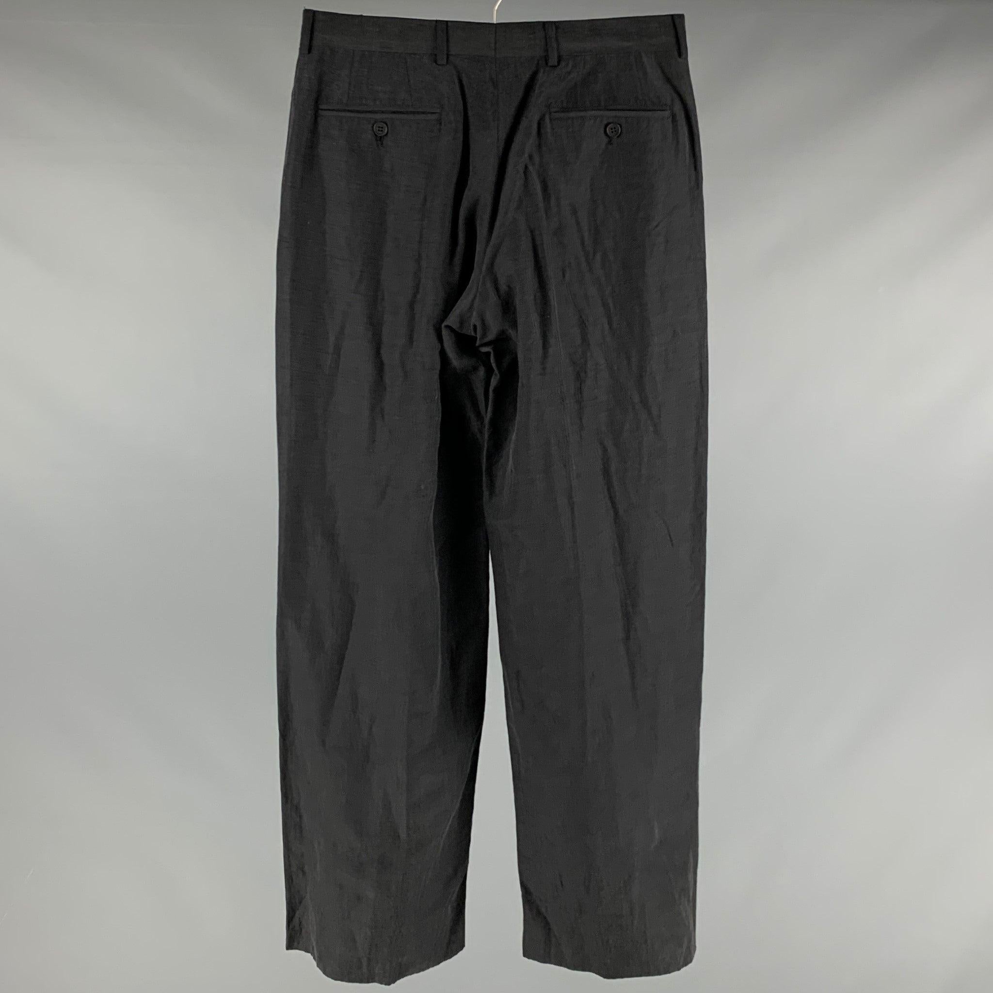 EMPORIO ARMANI dress pants
in a black linen silk blend fabric featuring wide leg style, four pockets, and a zip fly closure. Made in Italy.Very Good Pre-Owned Condition. Minor signs of wear. 

Marked:  IT 48 

Measurements: 
 Waist: 32 inches Rise: