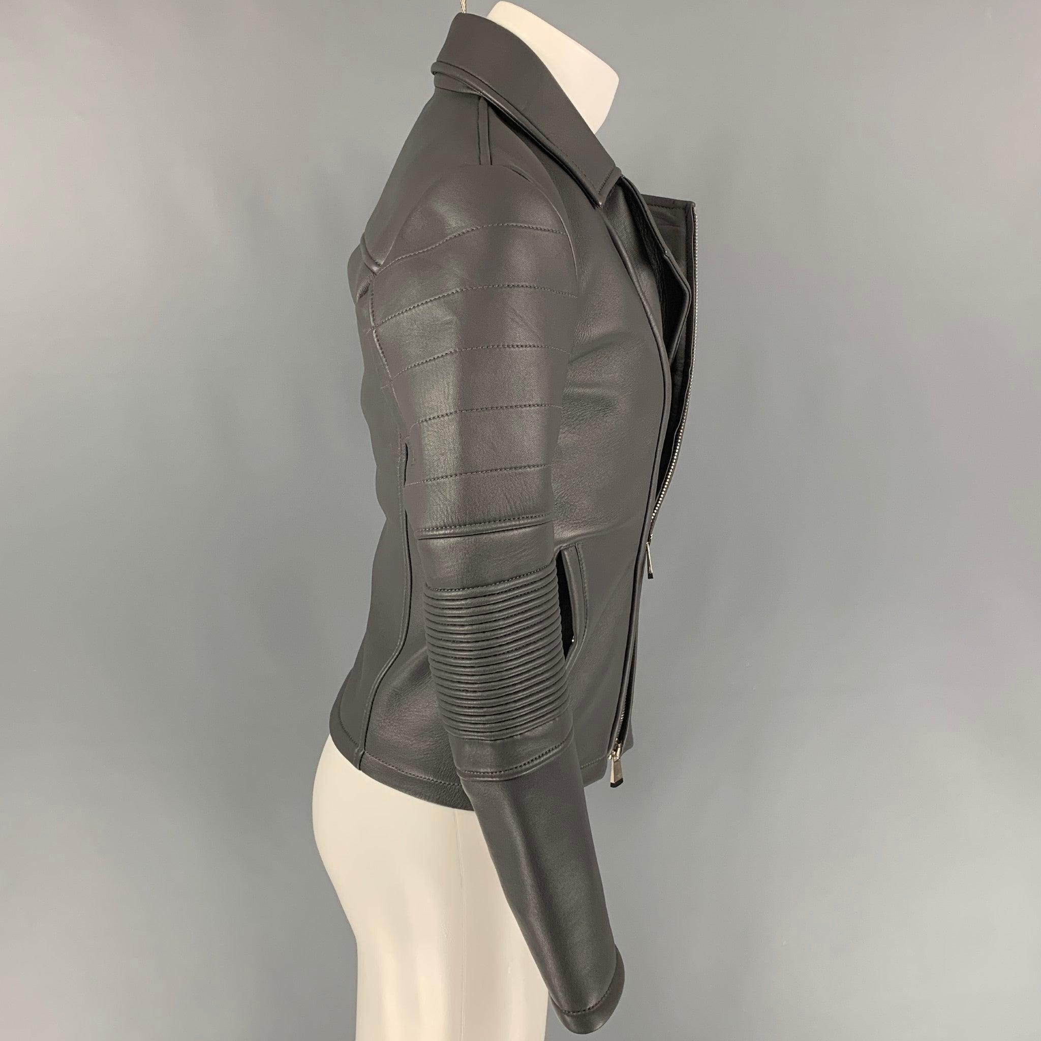 EMPORIO ARMANI jacket comes in a grey leather with a full liner featuring a biker style, ribbed sleeves, slit pockets, and a zip up closure. Made in Romania.New With Tags. 

Marked:   44 

Measurements: 
 
Shoulder: 17 inches  Chest: 36 inches 