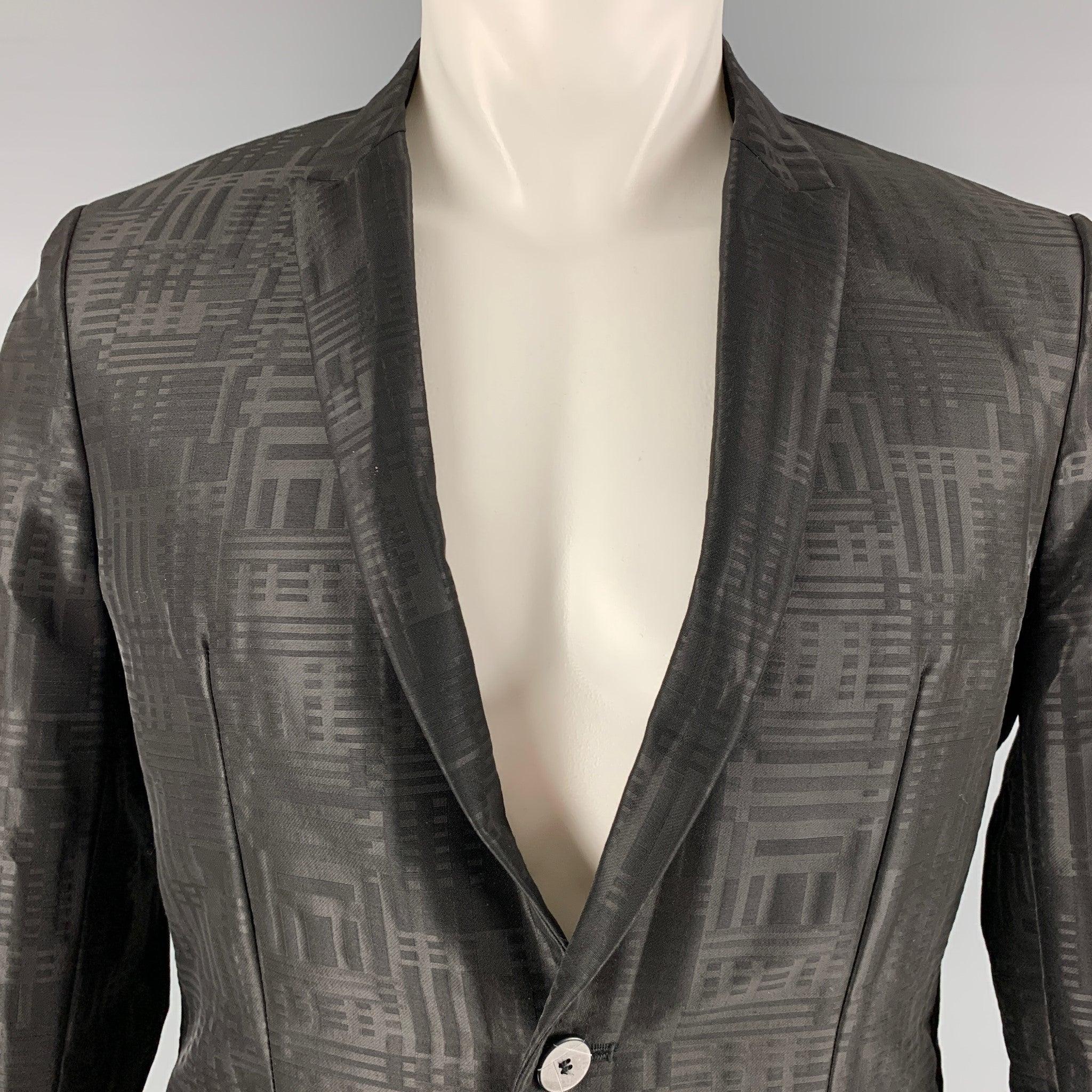EMPORIO ARMANI sport coat comes in a black wool woven material full liner featuring a peak lapel, welt pockets, and a single button closure. Made in Italy.Excellent Pre-Owned Condition.  

Marked:   48 

Measurements: 
 
Shoulder: 16.25 inches