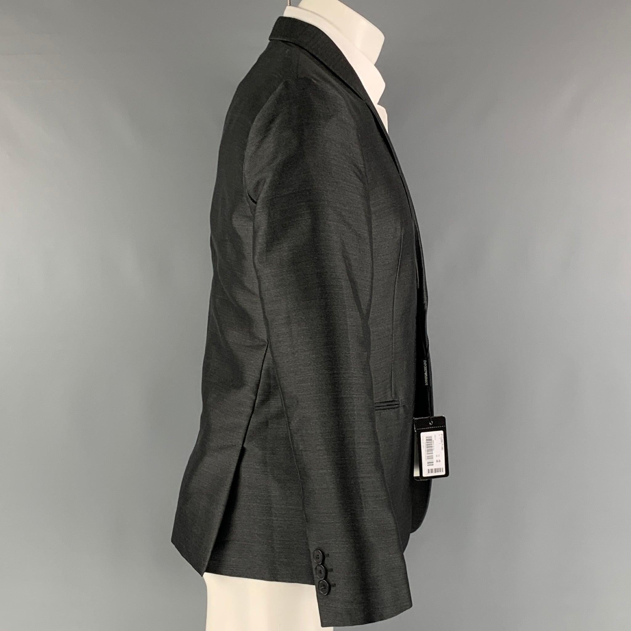EMPORIO ARMANI sport coat comes in a charcoal polyester woven material with a full liner featuring a shawl collar, welt pockets, and a single button closure. Made in Italy. New with Tags. 

Marked:   48 

Measurements: 
 
Shoulder: 16.5 inches