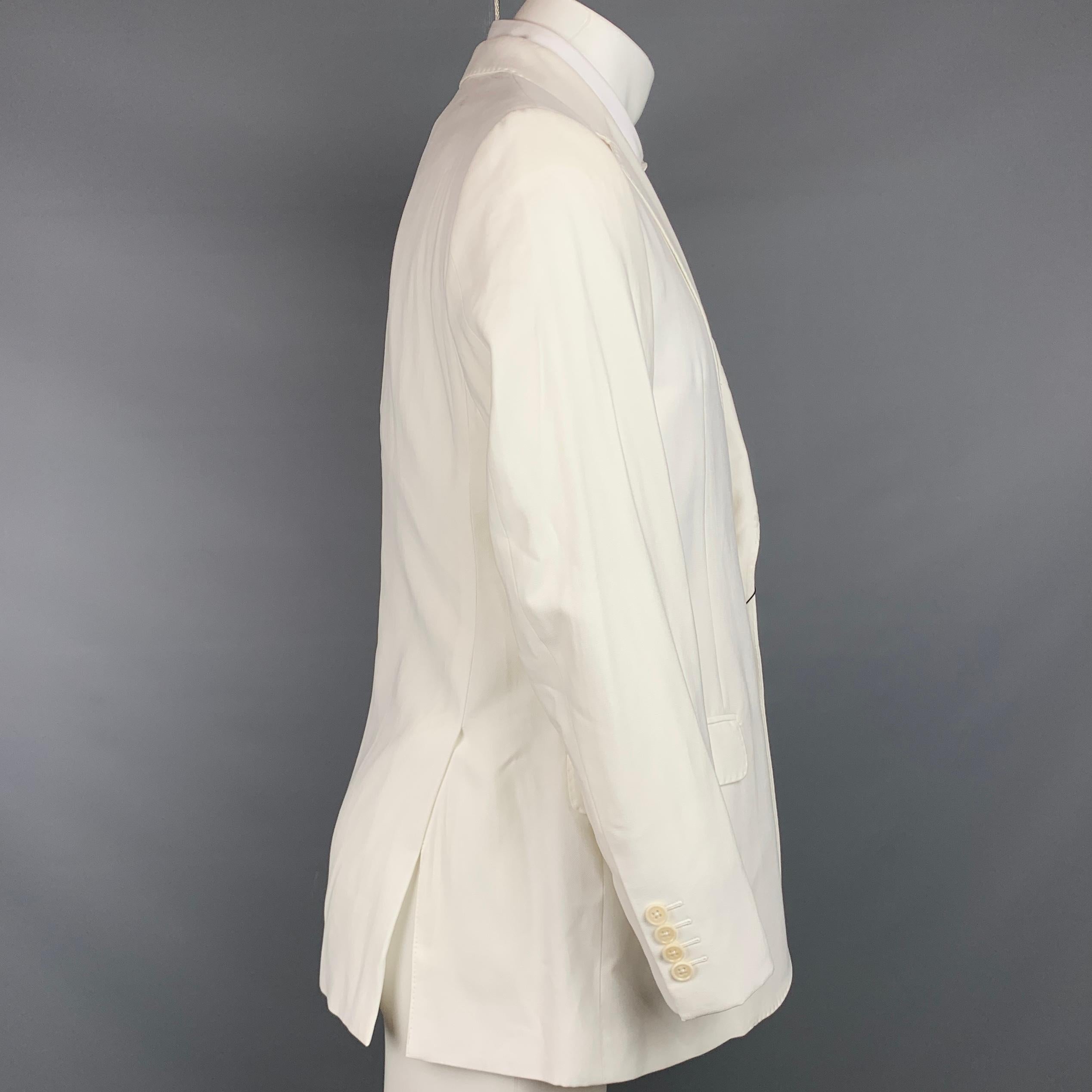 EMPORIO ARMANI sport coat comes in a white viscose blend with a full liner featuring a notch lapel, flap pockets, and a double button closure. Made in Bulgaria.

New With Tags.
Marked: 48
Original Retail Price: $995.00

Measurements:

Shoulder: 17.5
