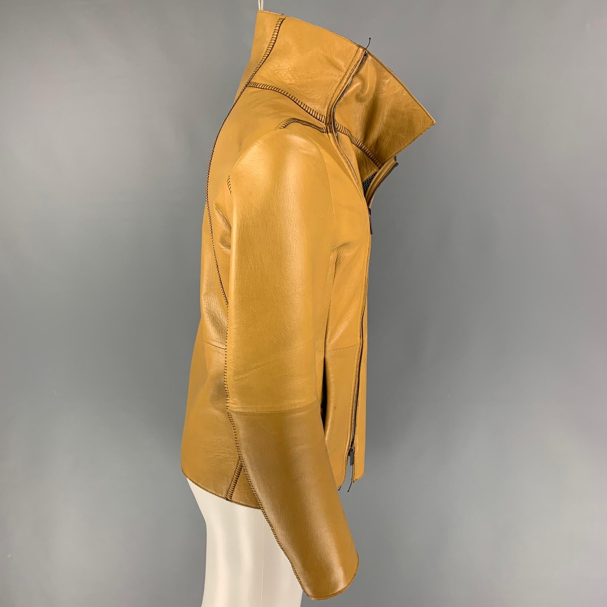 EMPORIO ARMANI jacket comes in a tan leather featuring a mesh liner featuring a high collar, top stitching, slit pockets, and a asymmetrical zip up closure. Made in Italy. 

Very Good Pre-Owned Condition. Light marks at back.
Marked: