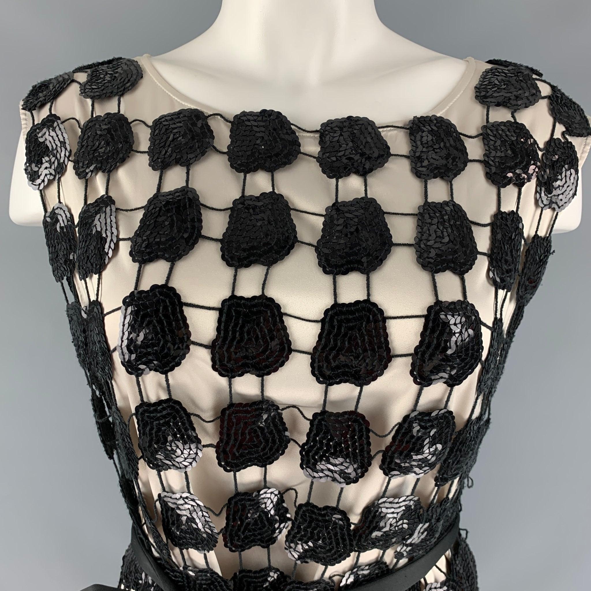 EMPORIO ARMANI cocktail dress in a cream polyester fabric featuring all over checkered sequin overlay, tied belt, and crew neck.Very Good Pre-Owned Condition. Minor signs of wear. 

Marked:  40 

Measurements: 
 
Shoulder: 15 inches Bust: 33 inches
