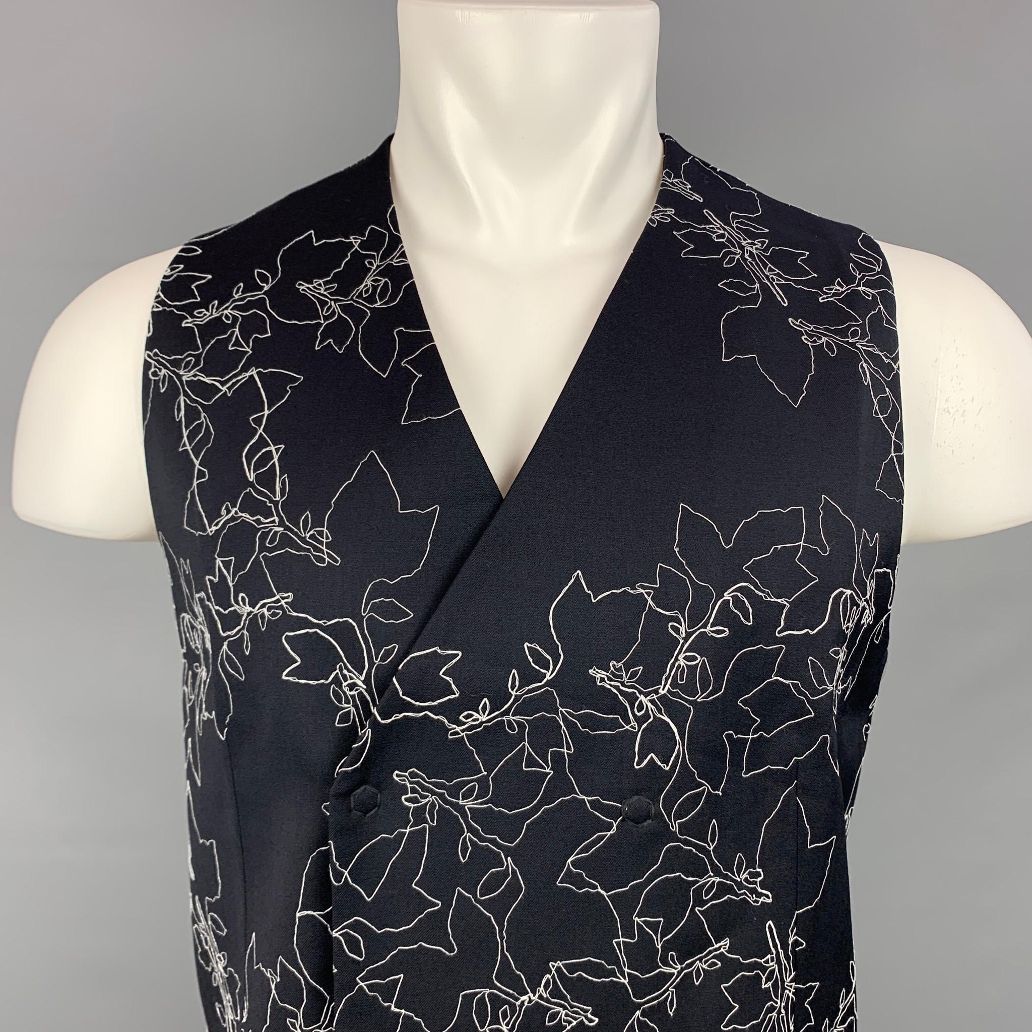 EMPORIO ARMANI vest comes in a black & white wool with a embroidered design featuring a full liner and a double breasted snap button closure. Made in Italy.

New With Tags. 
Marked: IT 48 / CHN 175/96A / BRA 48 / MEX 48 / USA 48
Original Retail