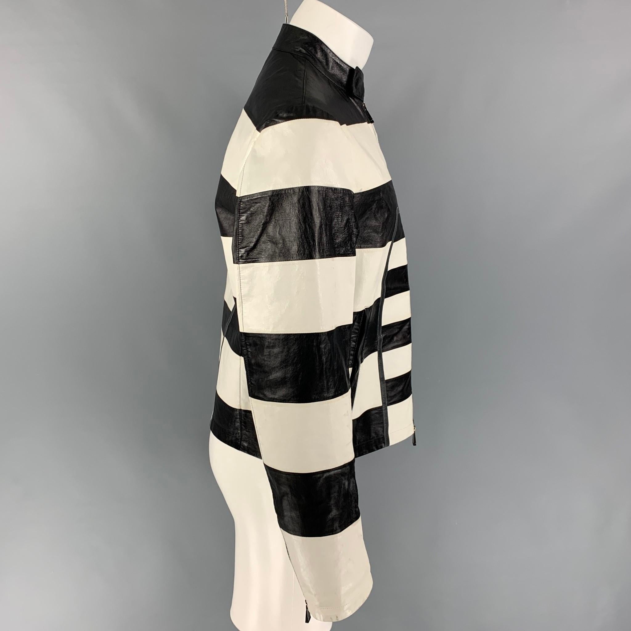 EMPORIO ARMANI jacket comes in a black & white stripe lamb skin leather featuring a snap button collar, zipped sleeves, front pockets, and a full zip up closure. Made in Italy. 

Very Good Pre-Owned Condition.
Marked: 50

Measurements:

Shoulder: 18