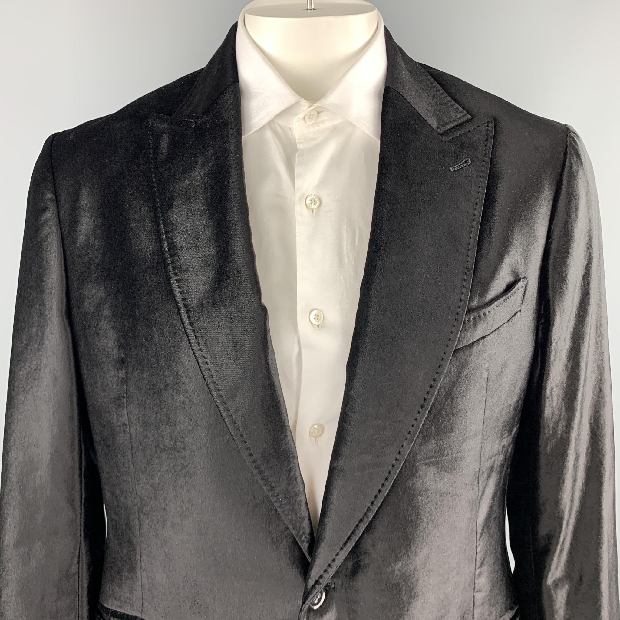 EMPORIO ARMANI sport coat comes in black velvet with a peak lapel, single breasted, one button front, and top stitching throughout. Made in Portugal. 

Excellent Pre-Owned Condition.
Marked: US 44

Measurements:

Shoulder: 19.5 in.
Chest: 46