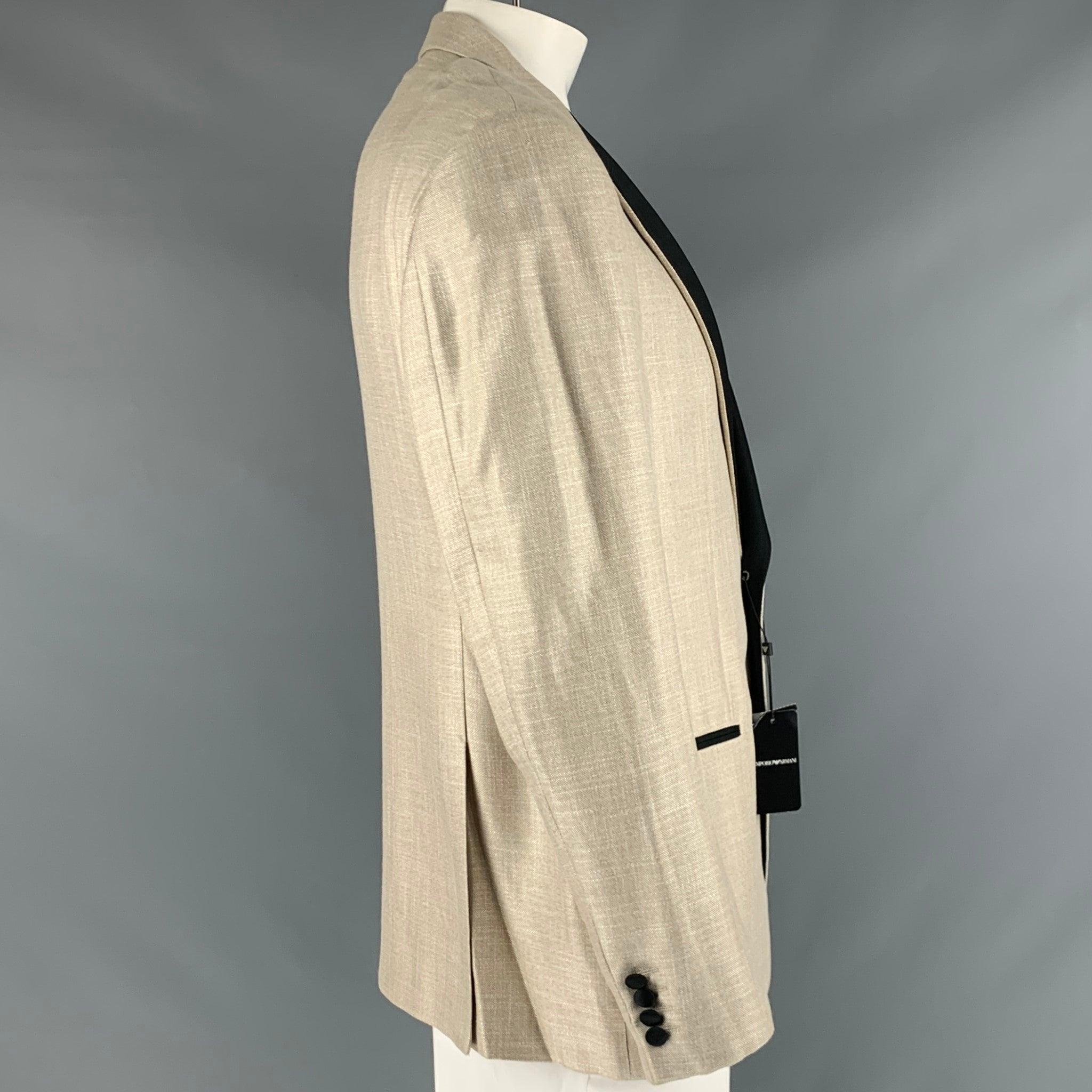 EMPORIO ARMANI sport coat
in a creamy oatmeal viscose blend fabric, featuring contrast black peak lapel, three pockets, and a single button closure. Made in Bulgaria.New with Tags. 

Marked:   L 

Measurements: 
 
Shoulder: 19 inches Chest: 44