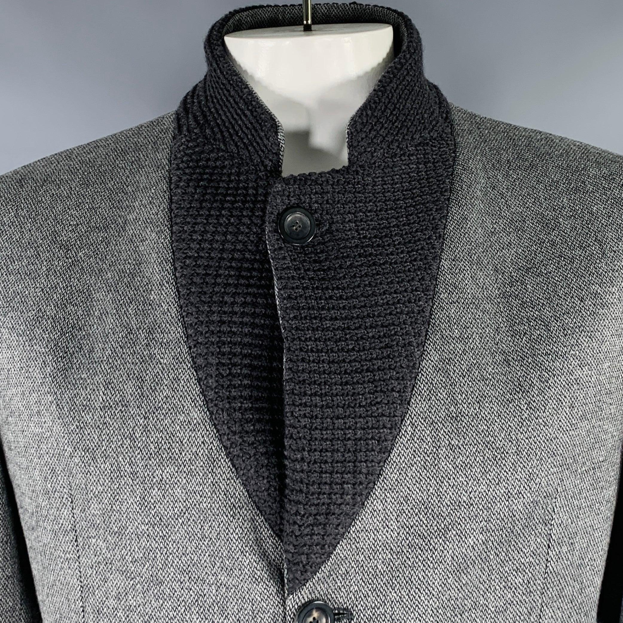 EMPORIO ARMANI sport coat
in a grey and black wool blend fabric featuring a knit notch lapel, ventless back, and three button closure. Made in Italy.Excellent Pre-Owned Condition. 

Marked:   IT 56 

Measurements: 
 
Shoulder: 17.5 inches Chest: 46
