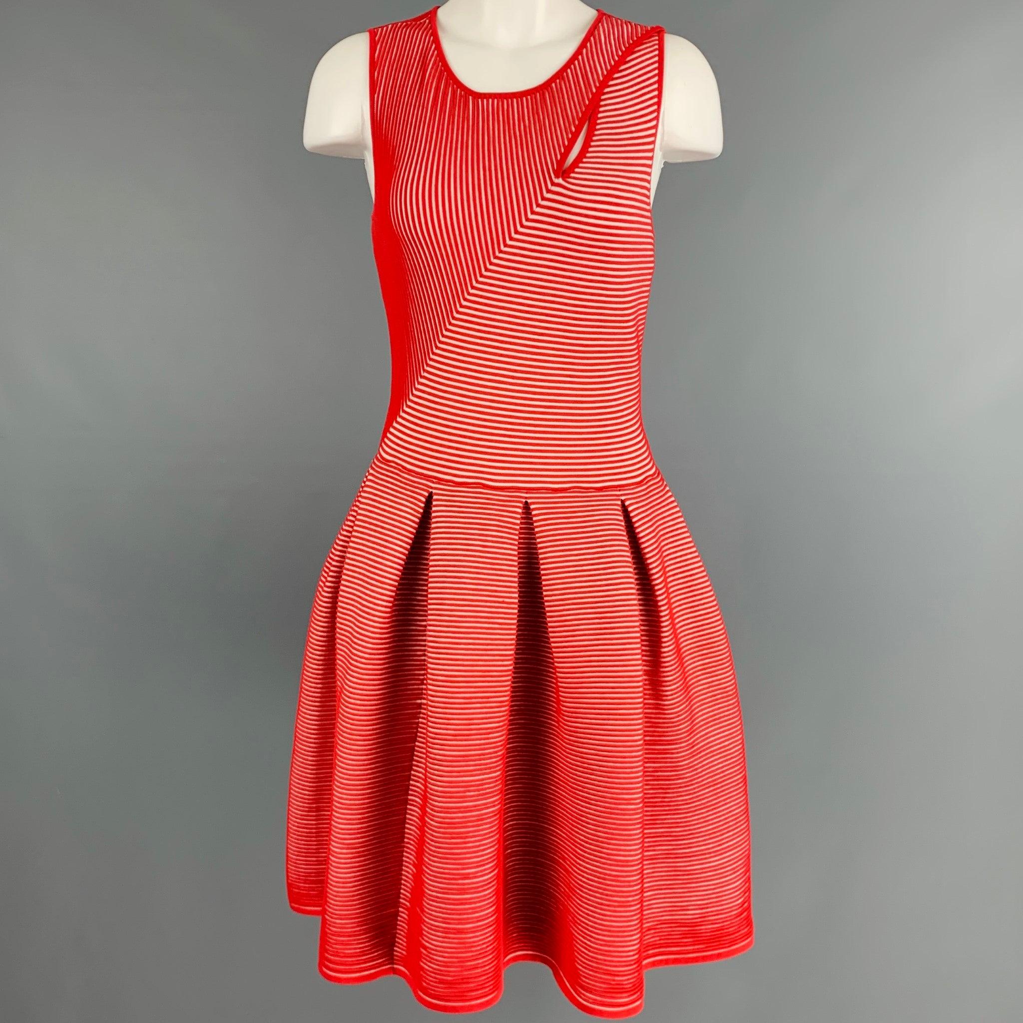 EMPORIO ARMANI dress
in a red and white viscose blend fabric featuring a textured stripe pattern, keyhole shoulder detail, and pleated A-line skirt.Excellent Pre-Owned Condition. 

Marked:  42 

Measurements: 
 
Shoulder: 13.5 inches Bust: 31 inches