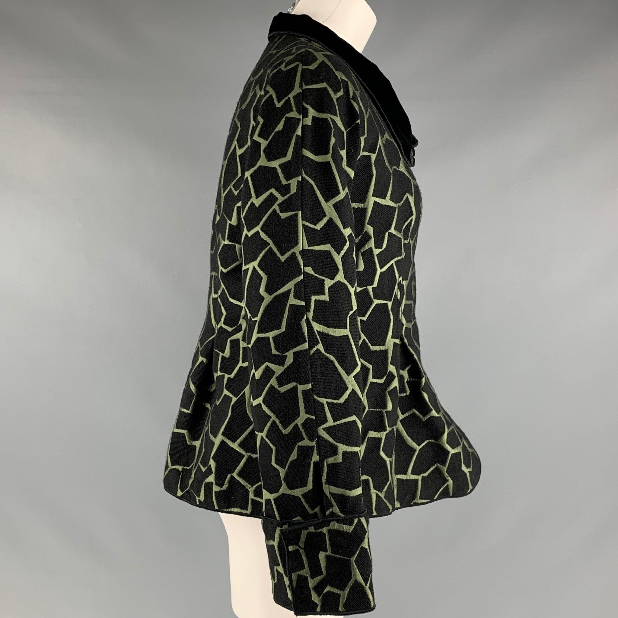 EMPORIO ARMANI blazer comes in black and green acrylic blend jacquard featuring black velvet detail at collar, two pockets at front, a shawl lapel, and snap button closure. Very Good Pre-Owned Condition. Minor signs of wear. 

Marked:   44