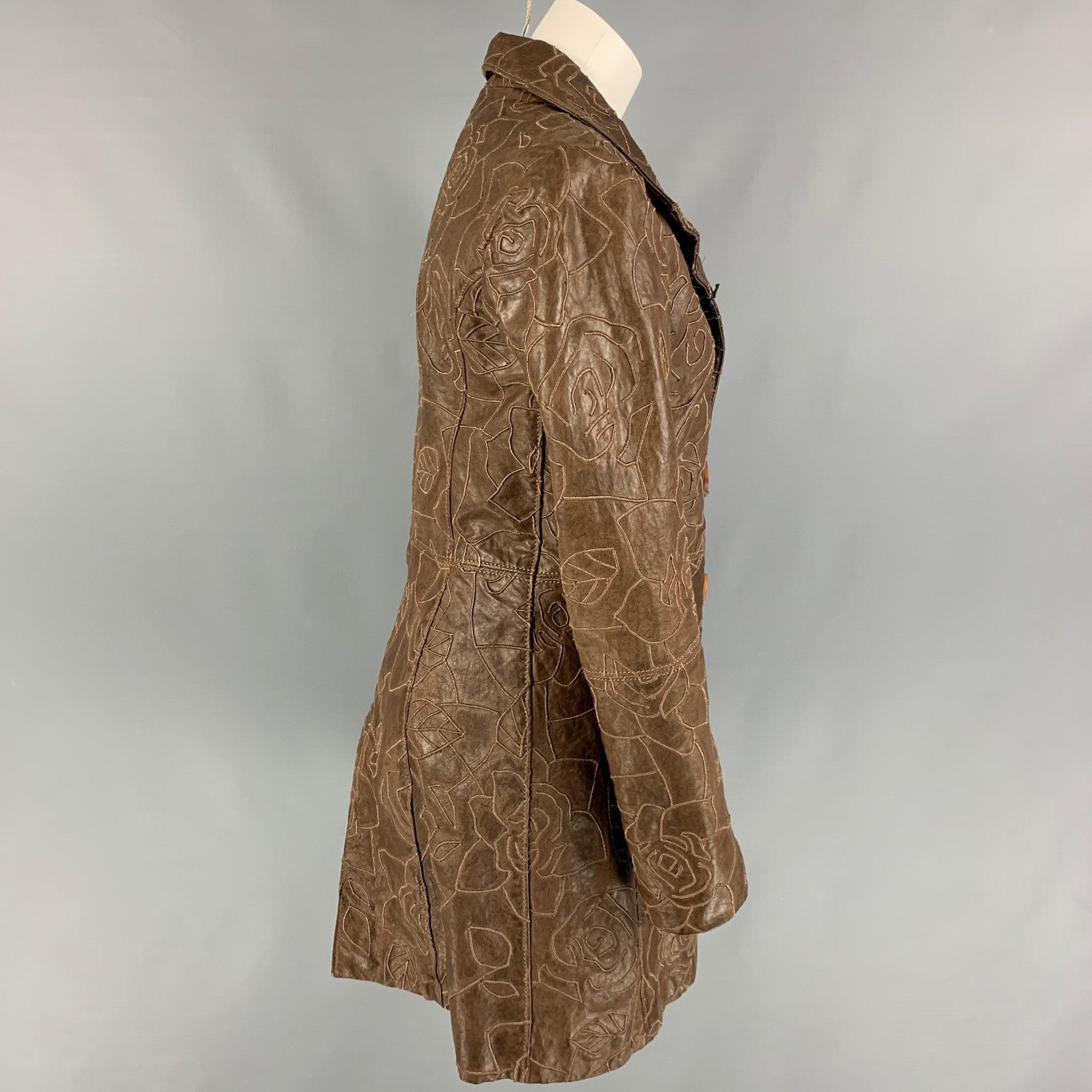 EMPORIO ARMANI coat comes in a brown leather featuring floral embroidery designs, high collar, slit pockets, and a wooden button closure.
Very Good
Pre-Owned Condition. 

Marked:   44 

Measurements: 
 
Shoulder: 16.5 inches  Bust: 36 inches 