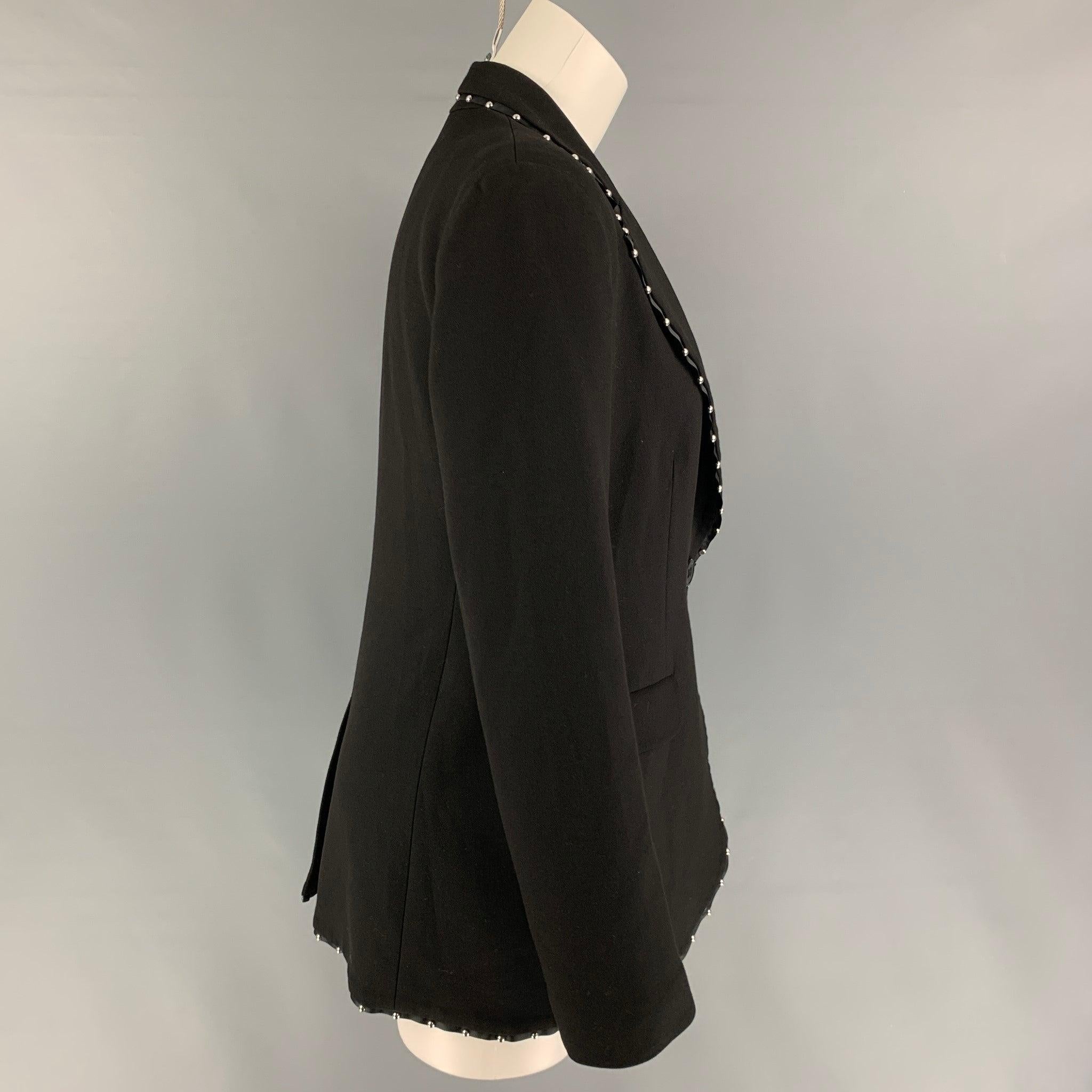 EMPORIO ARMANI jacket comes in a black wool blend with a full liner featuring a notch lapel, studded details, flap pockets, single back vent, and a single button closure.
Very Good
Pre-Owned Condition. 

Marked:   Size tag removed. 

Measurements: 
