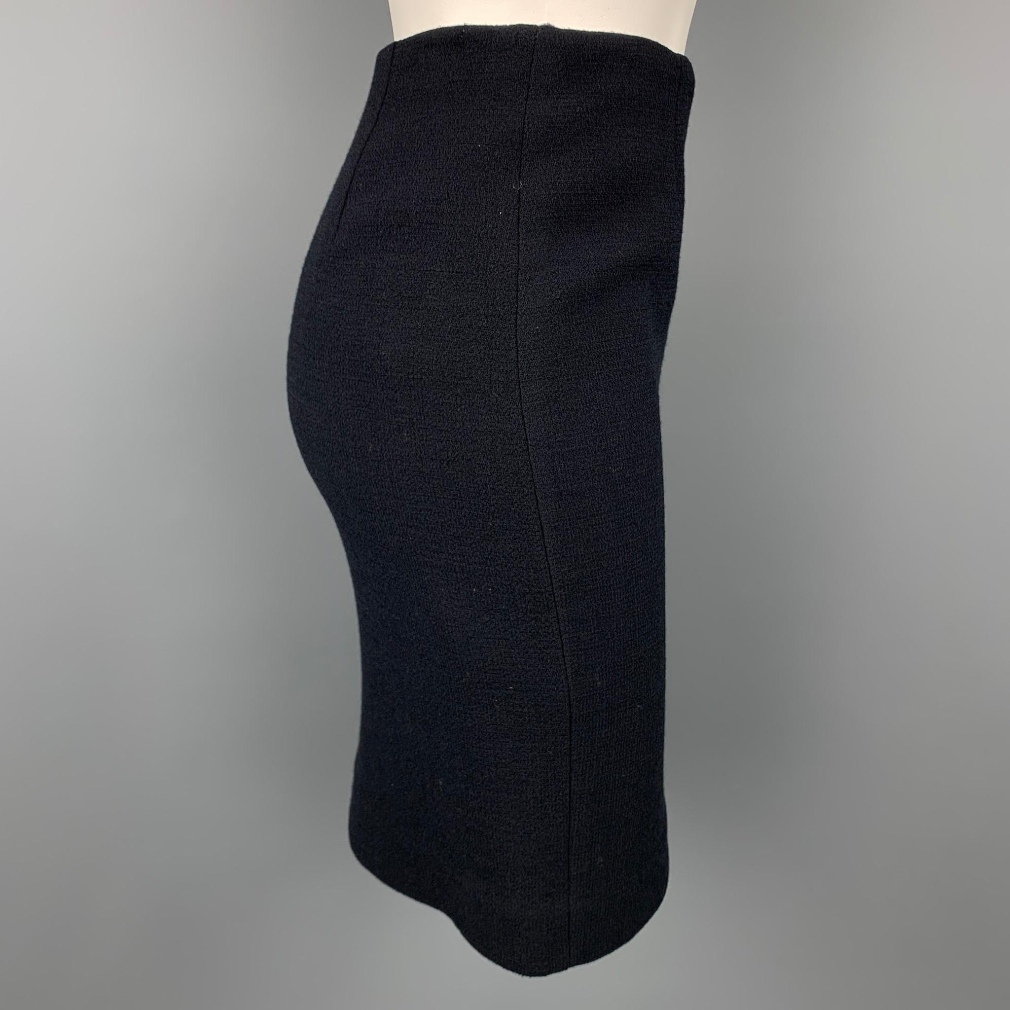 EMPORIO ARMANI skirt comes in a black crepe with a slip liner featuring a pencil style and a side zipper closure. Made in Italy.

Very Good Pre-Owned Condition.
Marked: No size marked

Measurements:

Waist: 26 in.
Hip: 32 in.
Length: 19 in. 