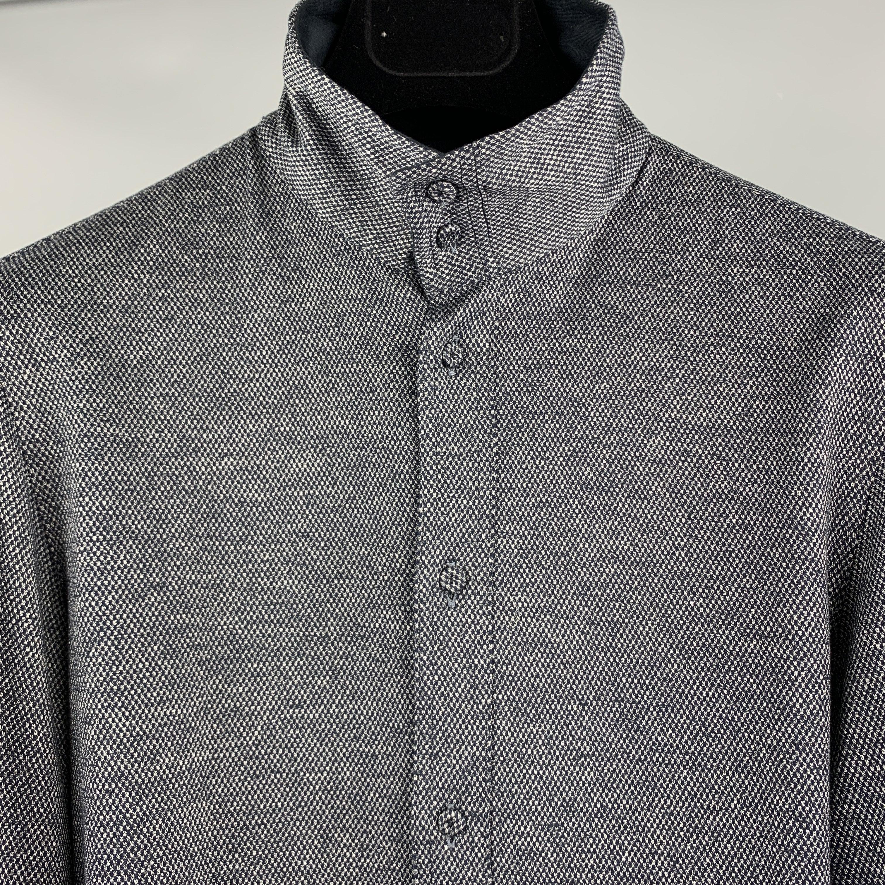 EMPORIO ARMANI Long Sleeve Shirt comes in grey and navy nailhead cotton material, featuring a wired high collar, and buttoned front and cuffs.
Excellent
Pre-Owned Condition. 

Marked:   38 / 15 

Measurements: 
 
Shoulder: 16 inches 
Chest: 36