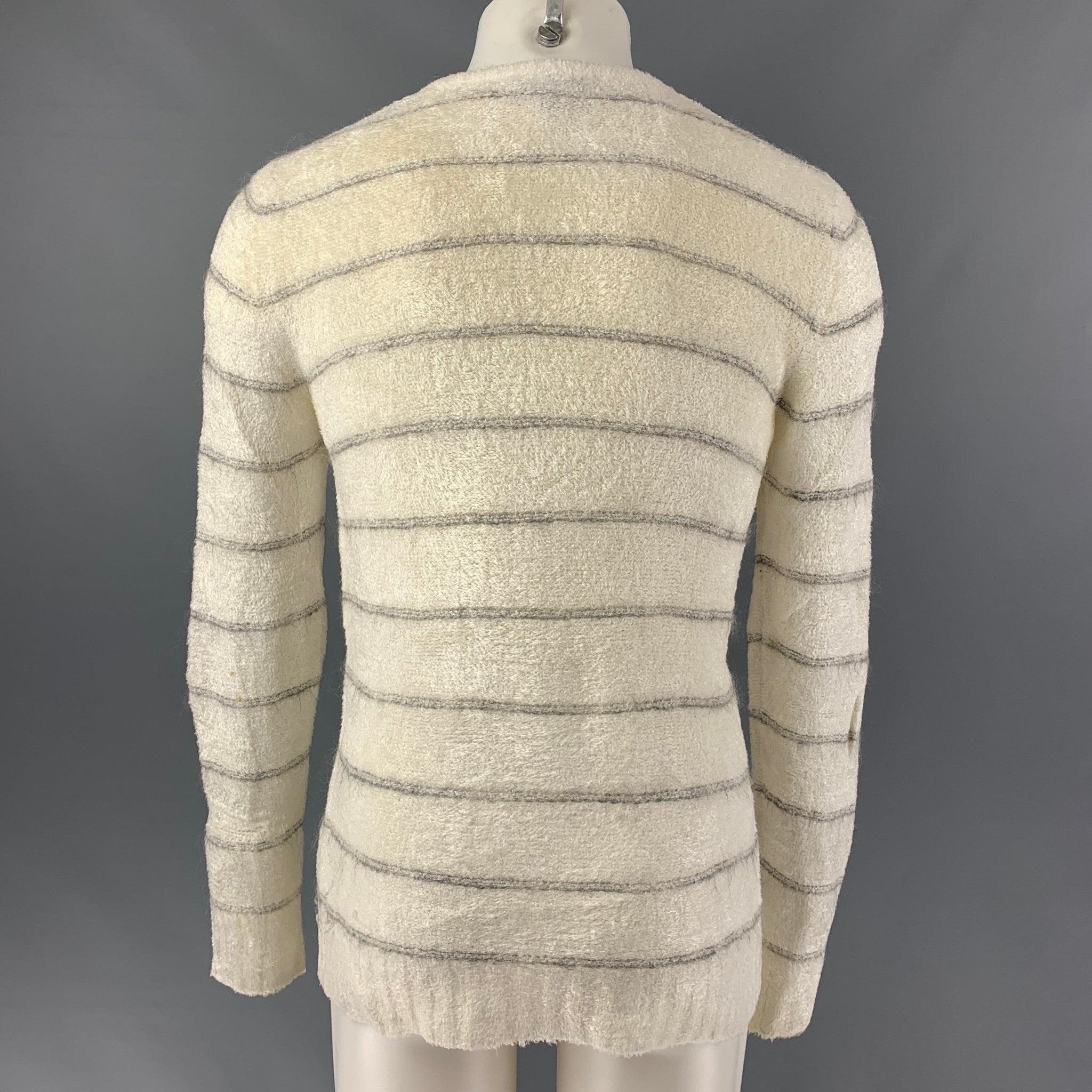 EMPORIO ARMANI sweater comes in a off white and grey stripped viscose blend chenille knit, featuring a v- neck. Made in Italy. Good Pre-Owned Condition. Minor seam splitting at right sleeve hem. 

Marked:   IT 36 

Measurements: 
 
Shoulder: 15