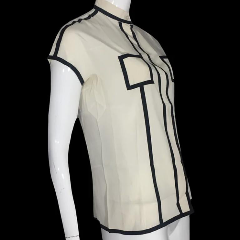 EMPORIO ARMANI SS2012 Cream silk shirt with black details

Tag EMPORIO ARMANI

Size M

Shoulder 37cm

Chest 40cm

Sleeve 15cm

Length 52cm

97% silk - 3% elastane

Perfect condition

Shipping worldwide with tracking number  