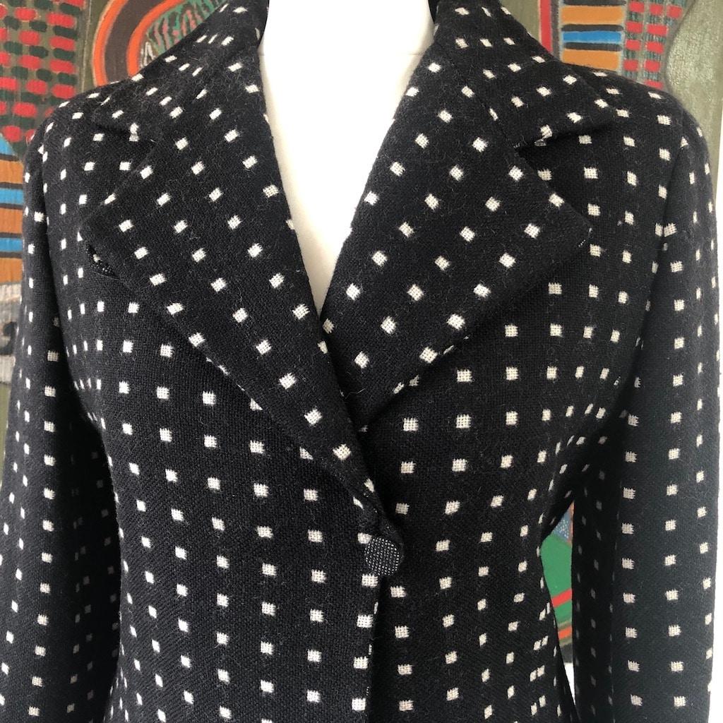 An elegant EMPORIO ARMANI Vintage Blazer Black White Runway Collection Jacket 1980s Featuring a black runway collection jacket designed by Giorgio Armani himself. It is a trendy and modern cut, large lapels, single button closure to the side, black