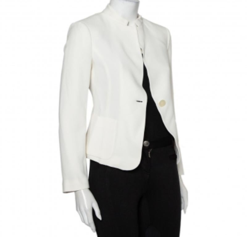 Elevate your beautiful casual style with this stylish jacket designed by Emporio Armani. Made from crepe in a white shade, the creation is detailed with front buttons and pockets for the finishing touch. Style it with straight-cut jeans for a chic