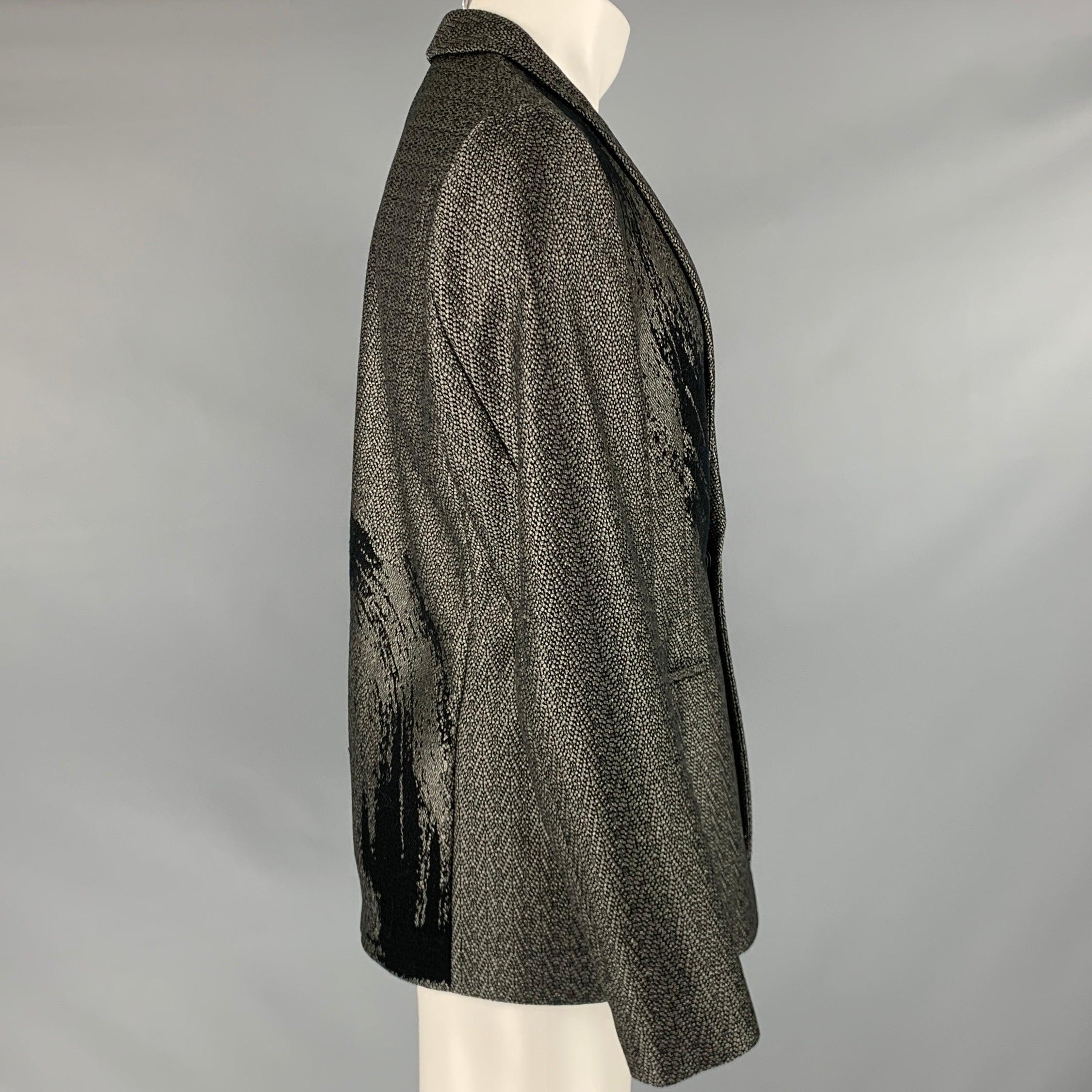 EMPORIO ARMANI sport coat
in a black woven fabric featuring brushstroke jacquard design, shawl collar, and single snap closure. Made in Italy.Very Good Pre-Owned Condition. Minor signs of wear. 

Marked:   size not marked 

Measurements: 
