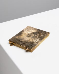 Empreinte (Fußabdruck), Puderdose aus vergoldeter Bronze von Line Vautrin, Frankreich