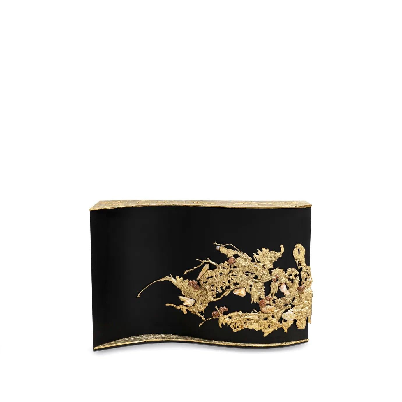 The Empress Console is fully aware of her powers, embraced in her untamed magnetic beauty. Exquisite sand-cast brass entangled with amber rock crystals wildly grows across her sleek, curved, ash-black wood veneer. This statement console, available