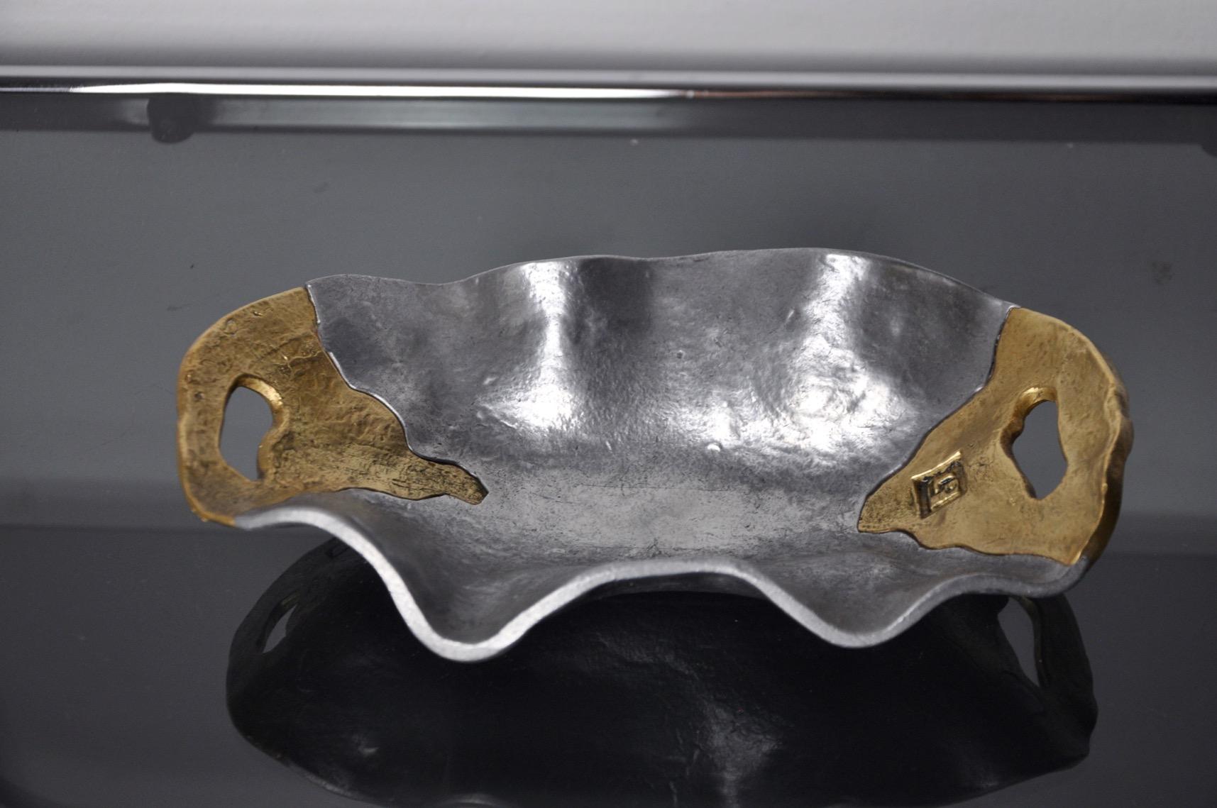 Superb empty pocket designed and produced by the artist David Marshall around the 80s, spain.brass and aluminum structure. Beautiful design object that will decorate your interior wonderfully. Marks of time relating to the age of the object. 

 