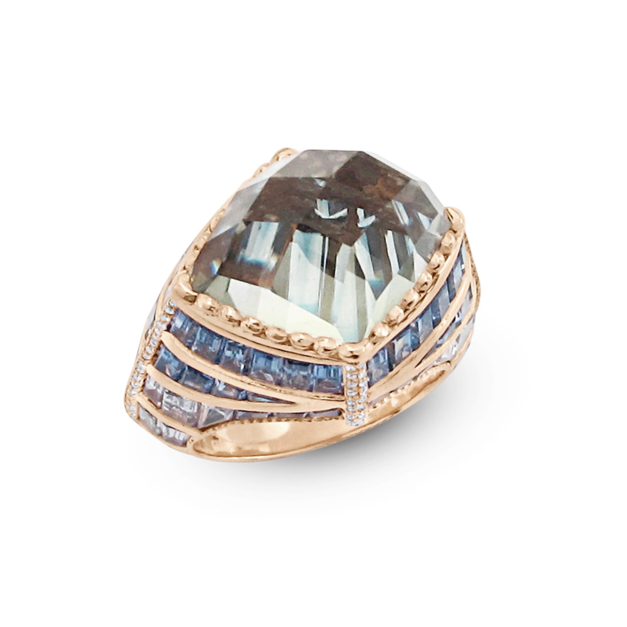 Enairo 18k Gold Blue Sapphire green Amethyst Diamond Cocktail Ring

This powerful piece is made of 18k rose gold and set with:

- 21.90 carats of delicate blue baguette cut sapphires
- Green Amethyst 10.27 ct. Faceted Cabochon
- White