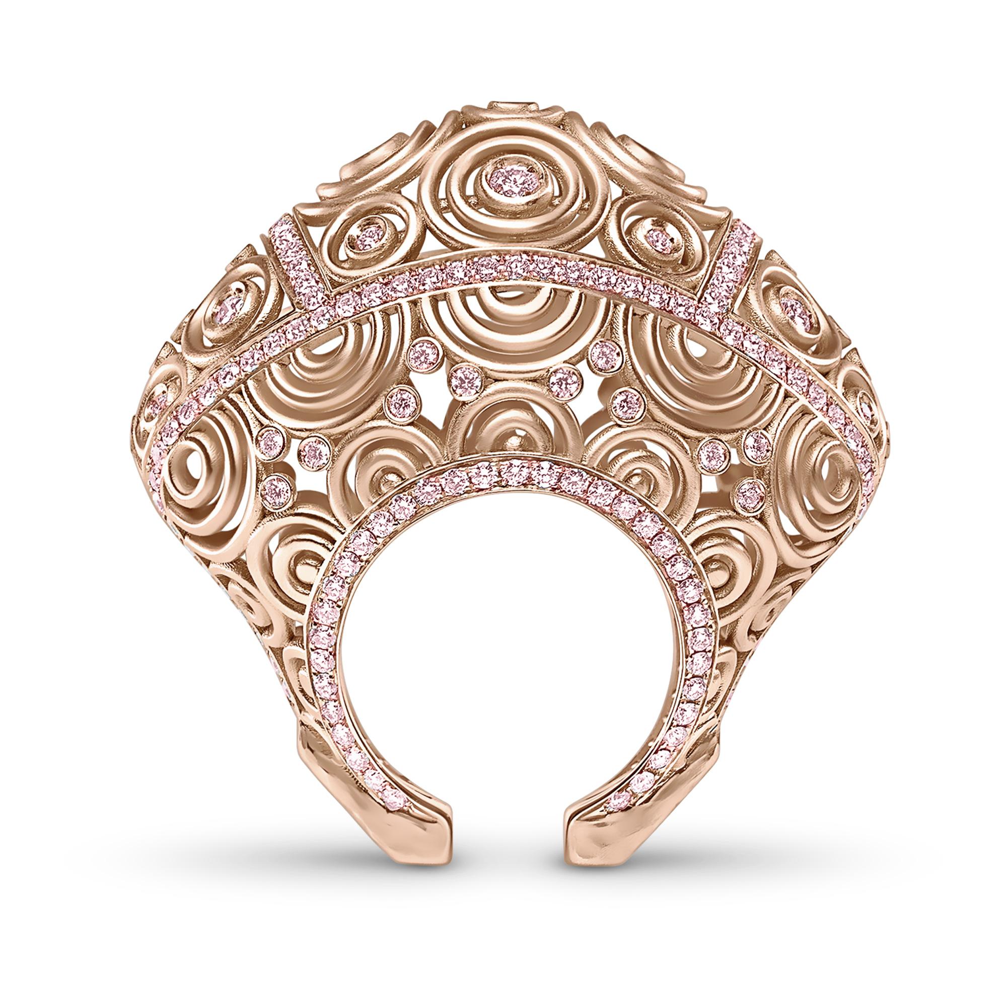 3.98 Carat Pink Sapphire 25 gr 18k Rose Gold Cocktail Ring

This magnificent ring is made of 18k rose gold, and set with approx. 3.98 carats pink sapphires embedded within a series of architectural circles. Total gold weight: 25 grams.
Please