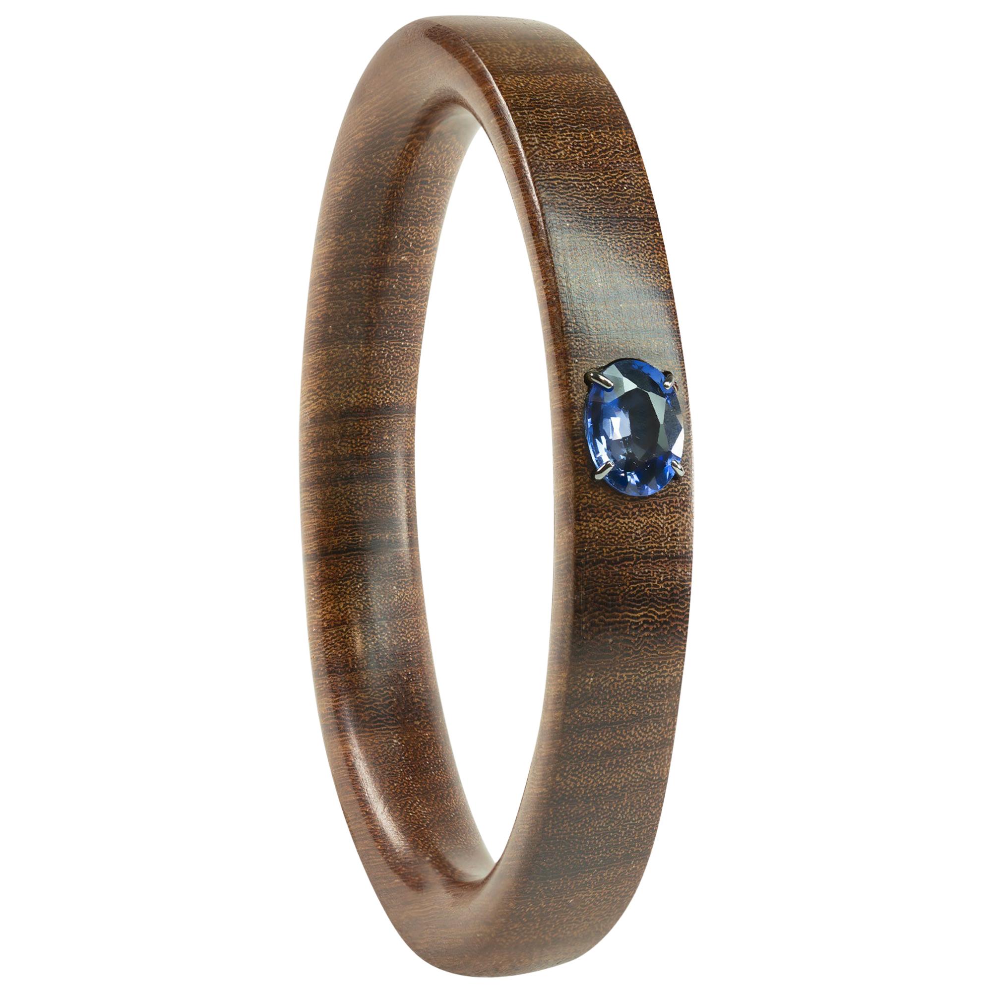 3.20 Carat Oval Blue Iolite Rosewood Bangle Bracelet For Sale